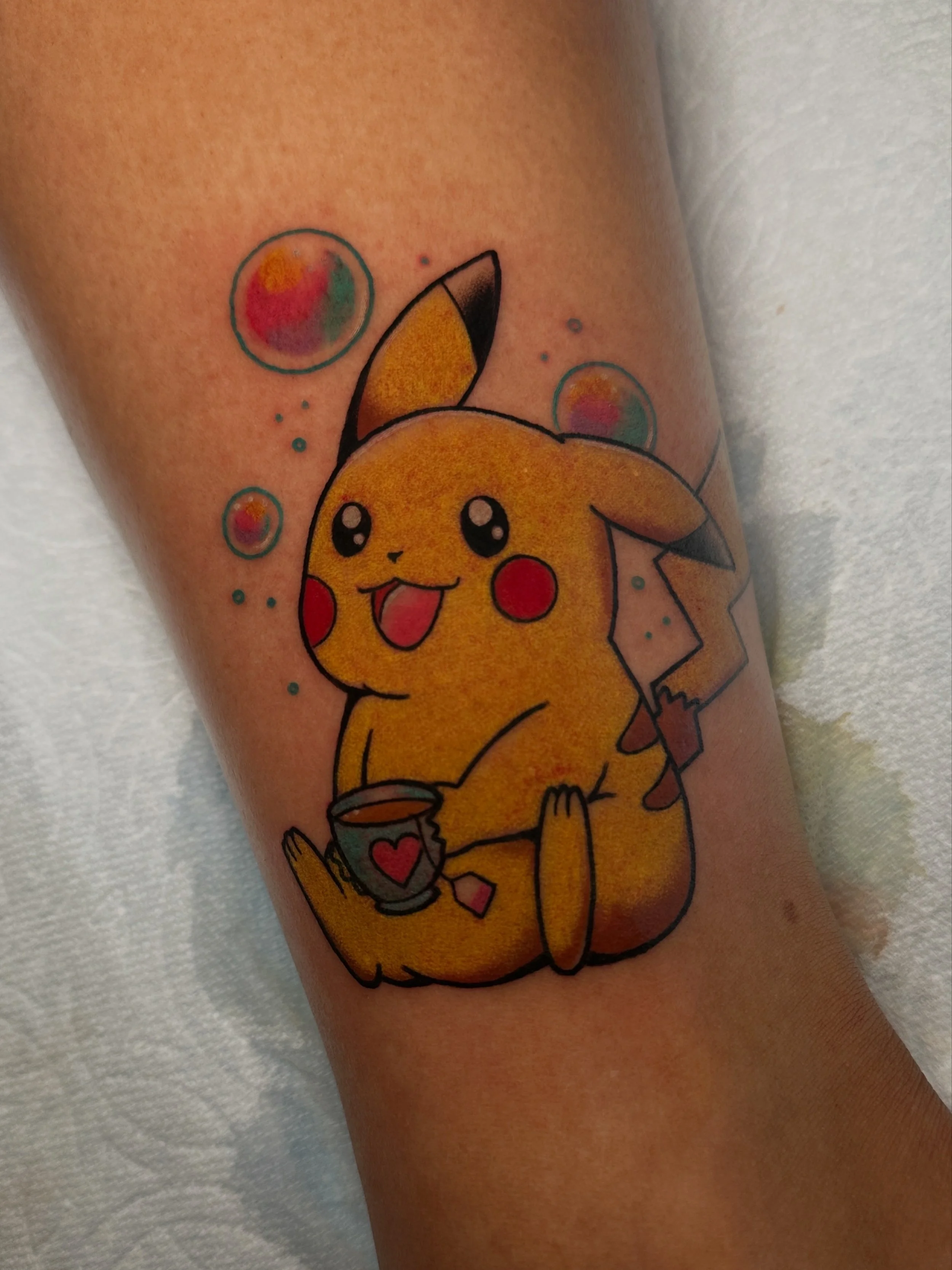 Pokémon tattoo by woman tattoo artist in North  Park ktrantattoos in San Diego, CA