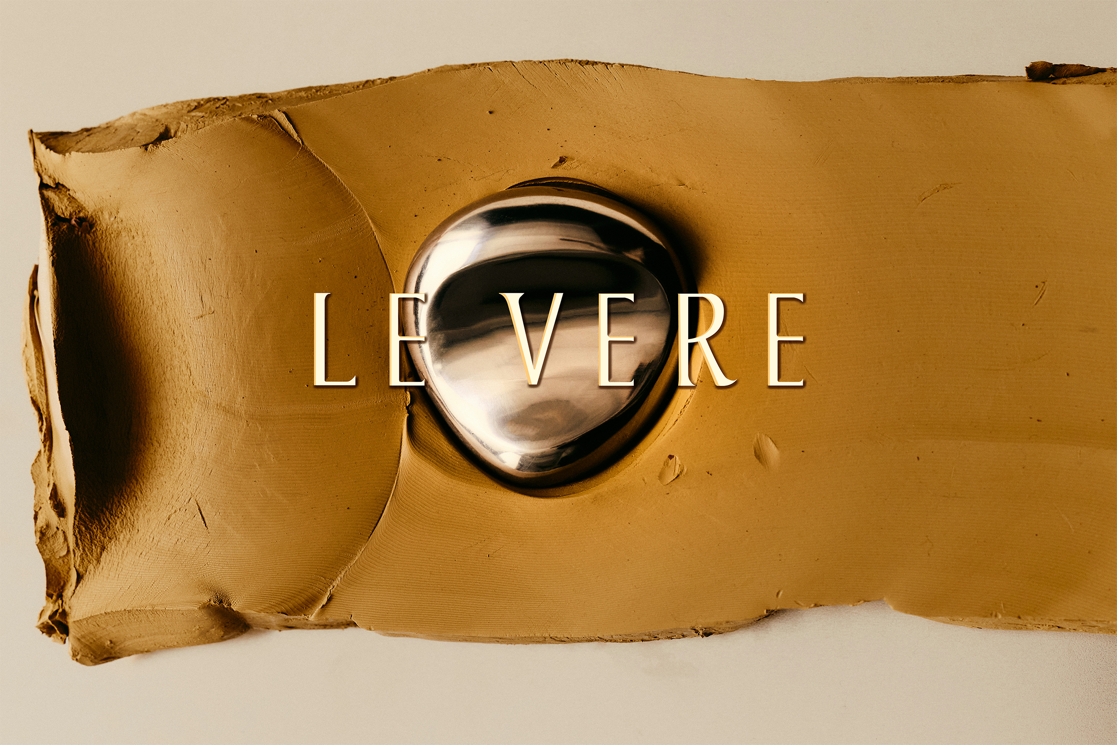 A metallic door handle installed on a yellow surface with the word 'LEVER' written across it.