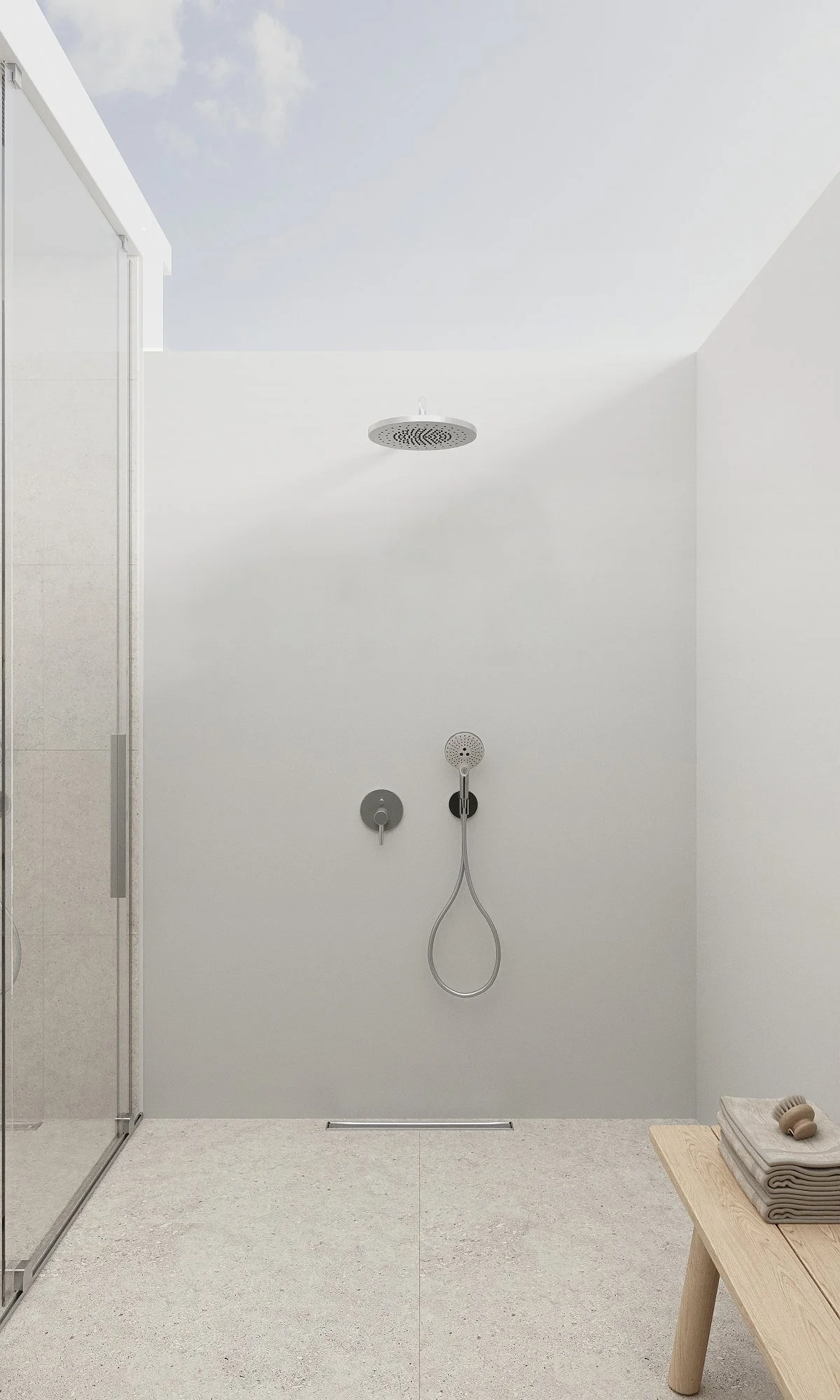 Minimalist shower area with white walls, overhead showerhead, handheld shower, and a wooden bench with towels and a wooden brush.