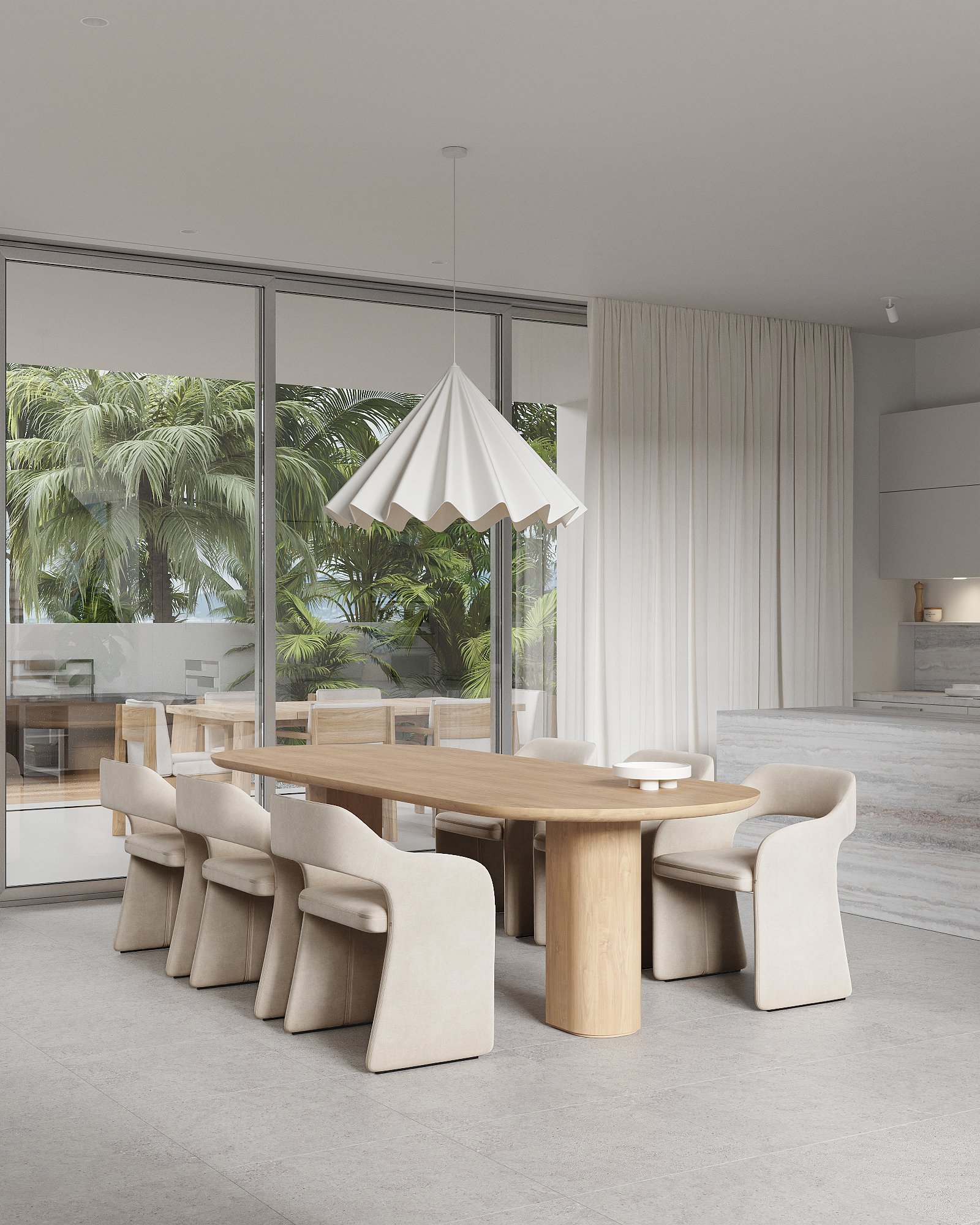 Modern dining room with a wooden table, eight beige upholstered chairs, a large white pendant light, and floor-to-ceiling windows showing tropical plants outside.