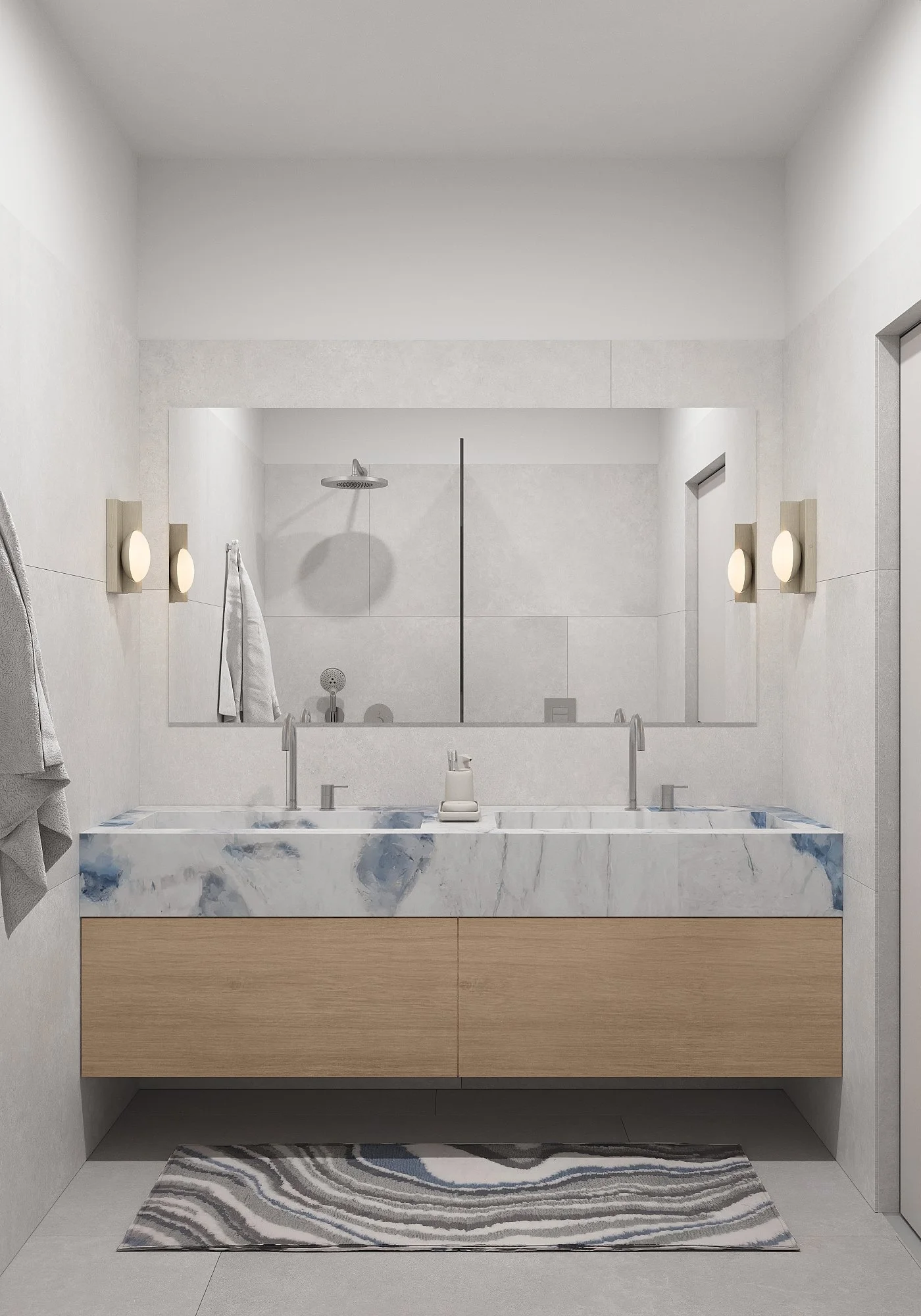 Modern bathroom with a marble double sink vanity, large mirror, wall-mounted lights, and a walk-in shower with a rainfall showerhead.