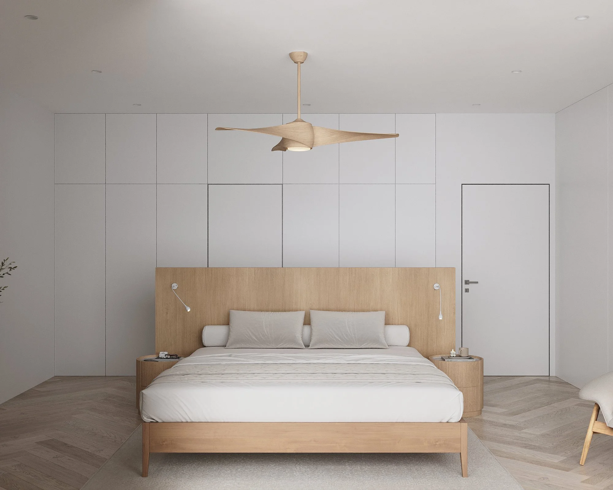 Minimalist bedroom with a wooden bed frame, white bedding, two white pillows, and a headboard featuring two wall-mounted reading lamps. The room has a white ceiling, light wood flooring, a ceiling fan with wooden blades, and a plain white wall with a