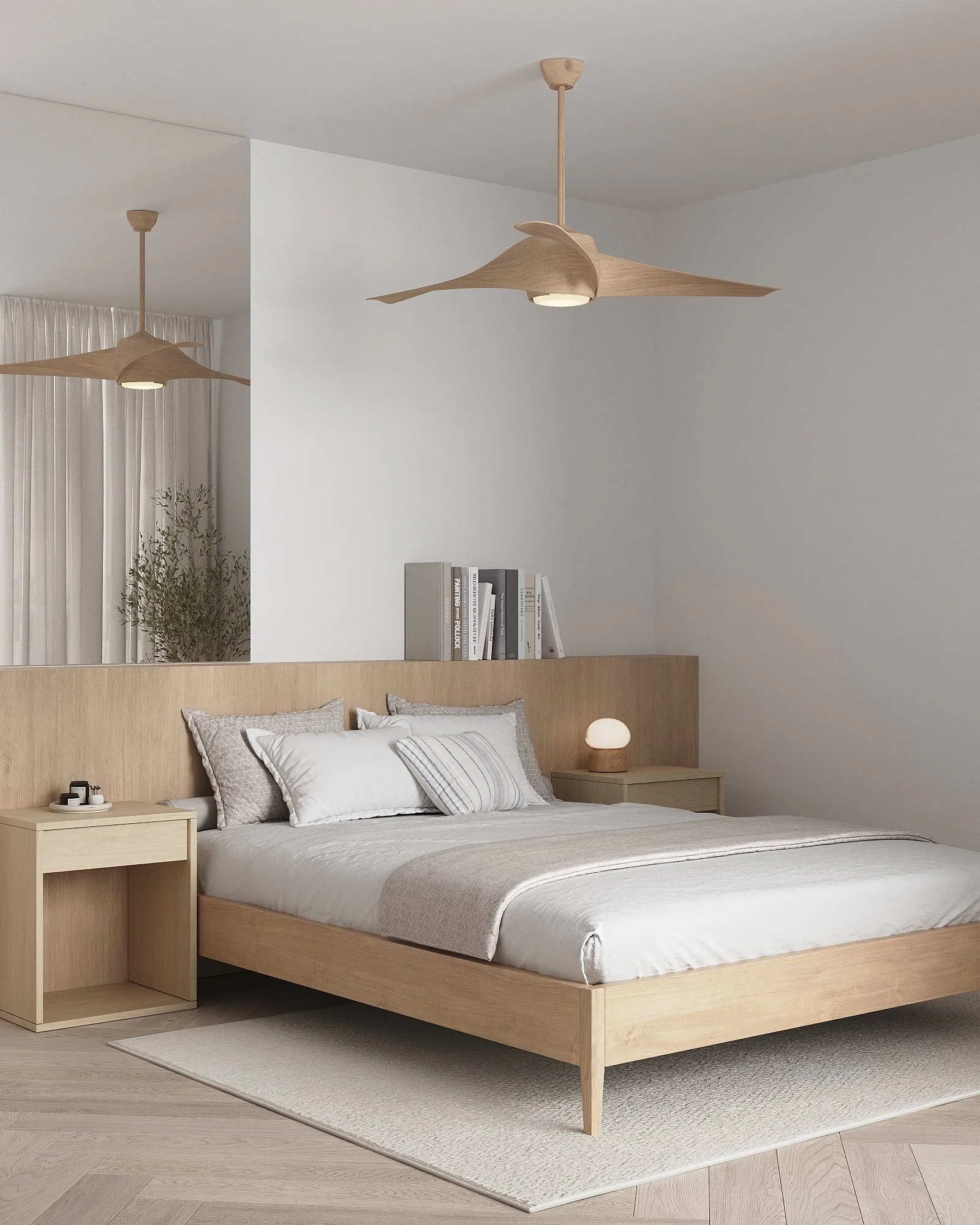A minimalist bedroom with a wooden bed frame, white bedding, and a beige side table with a lamp. Two modern ceiling fans hang from the ceiling, and a bookshelf is placed against the wall. Light-colored curtains are in the background.