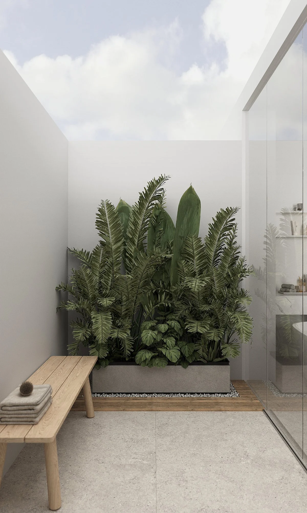 Minimalist outdoor shower with a large indoor plant in a rectangular planter, a wooden bench with folded towels, and a glass wall with a reflection of the plant. The ceiling opens to a view of a cloudy sky.