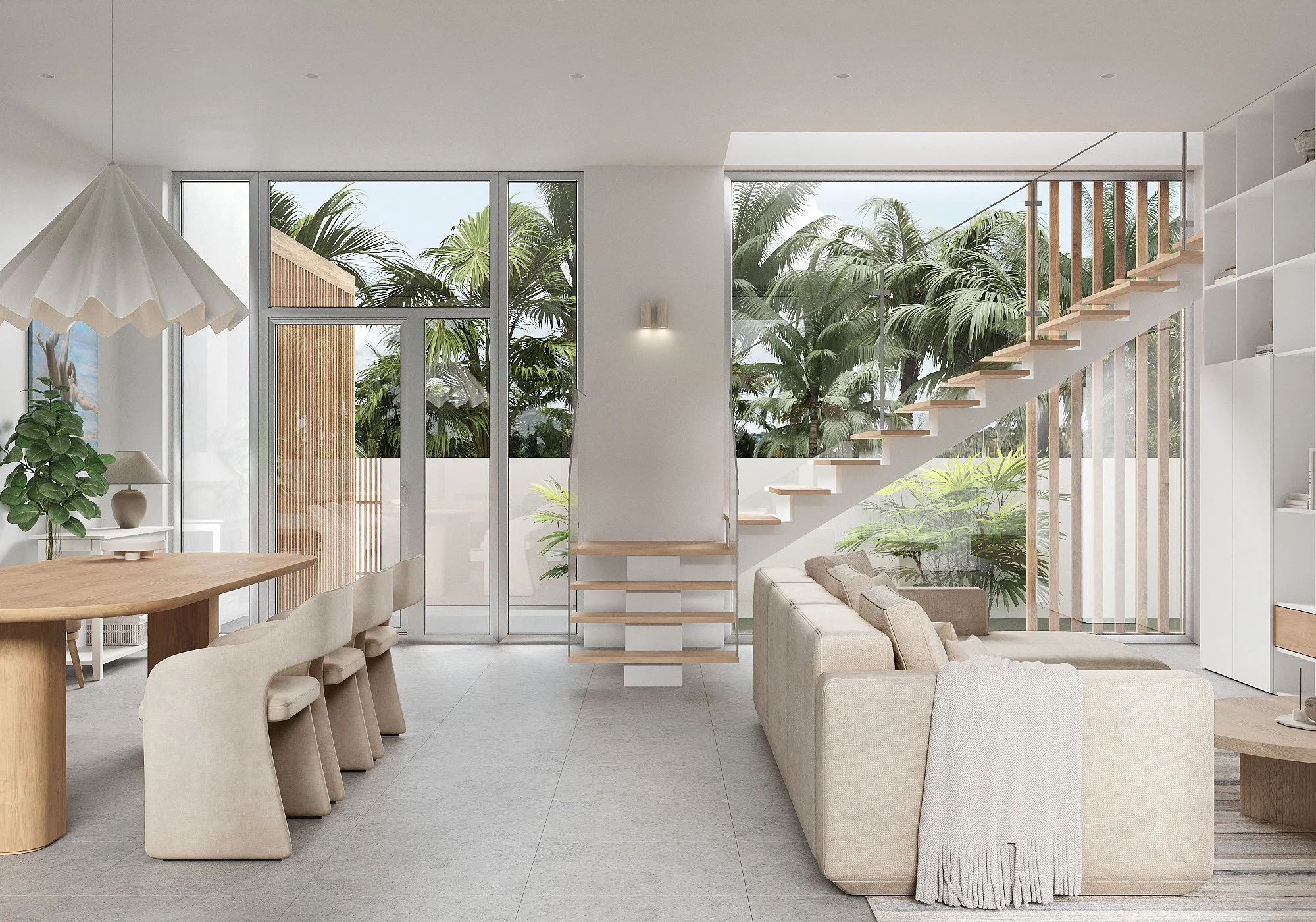 Modern living room with large glass doors and windows, wooden staircase, beige sofa, dining table with chairs, and tropical plants outside.