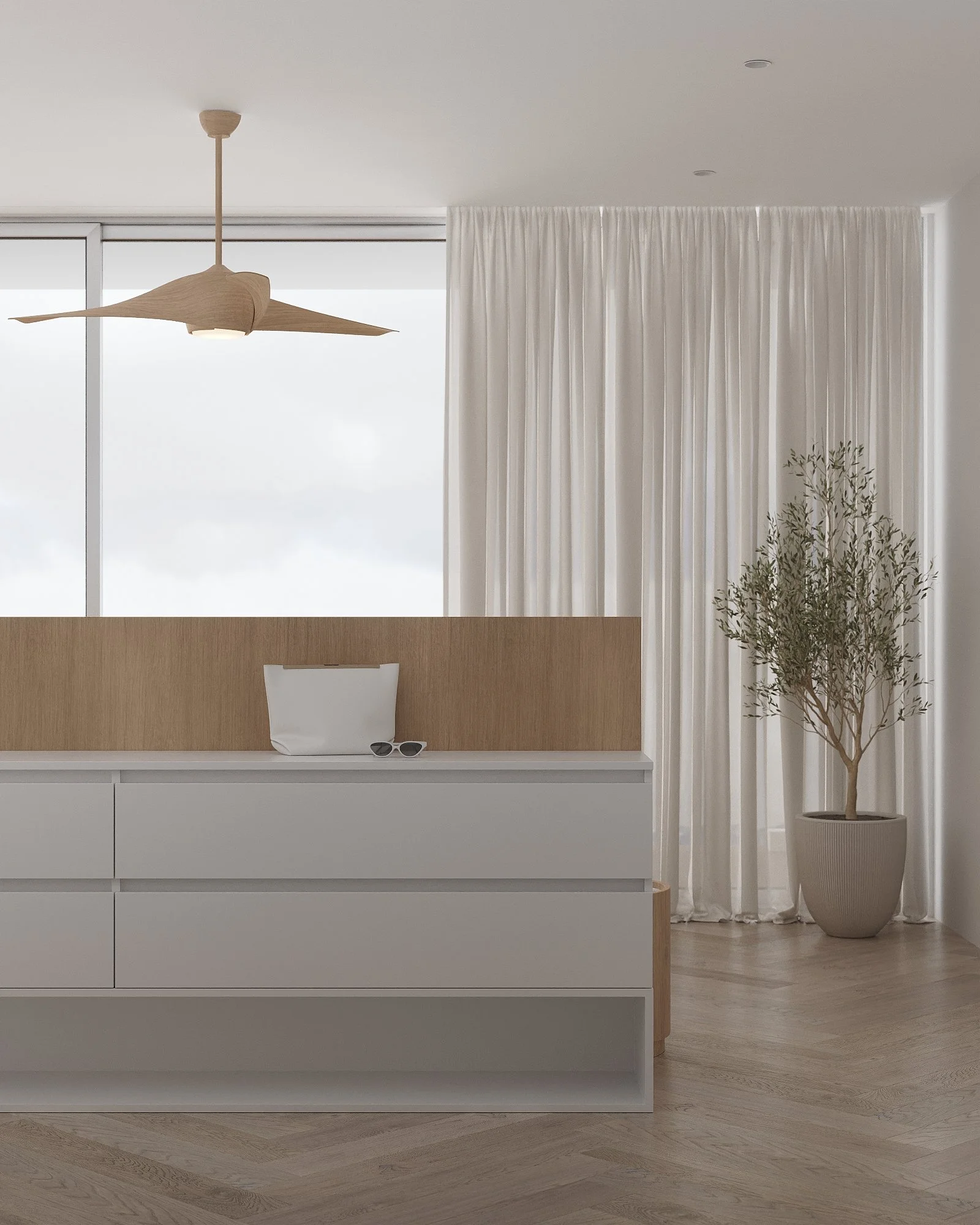 Minimalist interior with white dresser, potted plant, curtains, and ceiling fan.