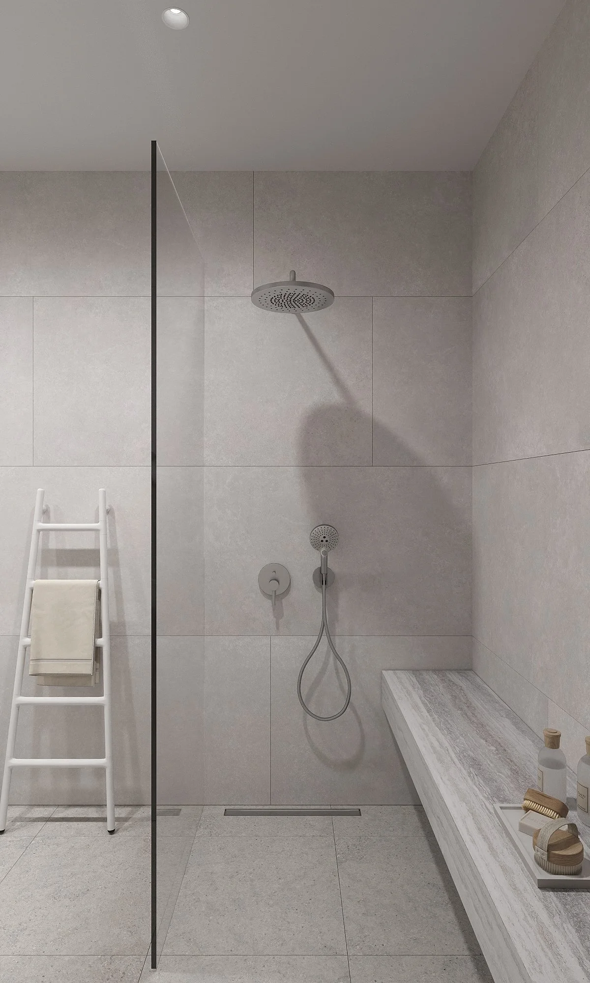 Modern walk-in shower with a ceiling rain showerhead, handheld shower, and a bench with toiletries, separated by a glass partition, with gray tiles on walls and floor, and a ladder with towels.
