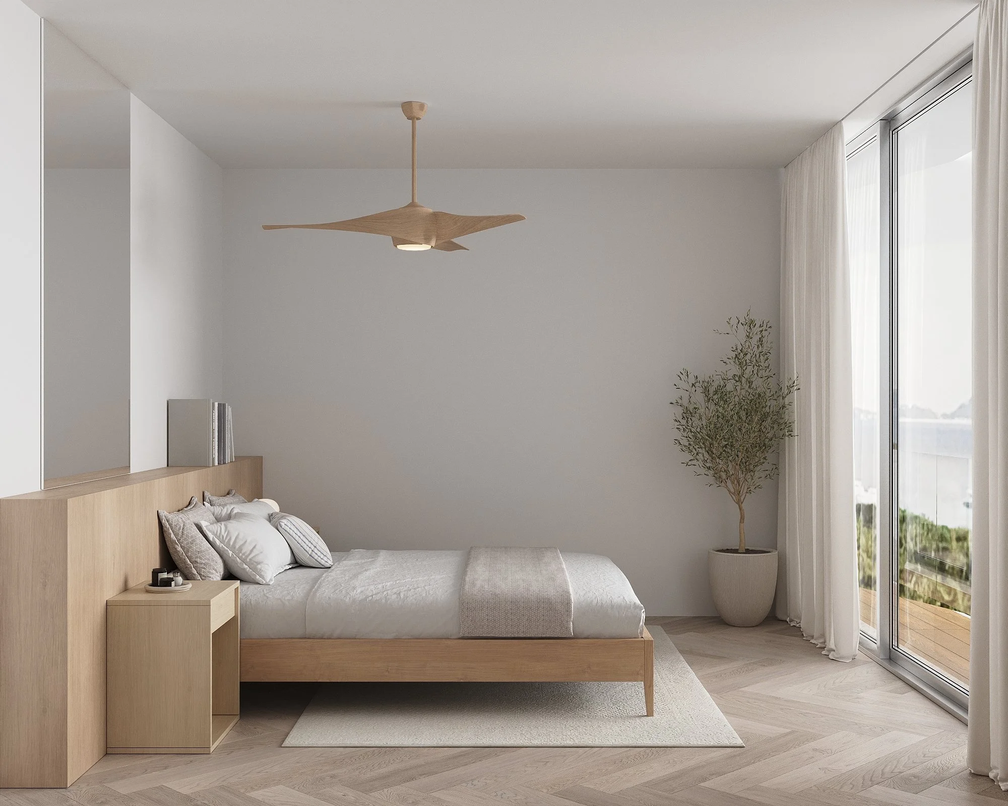 Minimalist bedroom with a wooden bed, white bedding, and multiple pillows, natural light coming through large glass sliding door, potted plant in corner, ceiling fan, light-colored hardwood floor, white curtains.