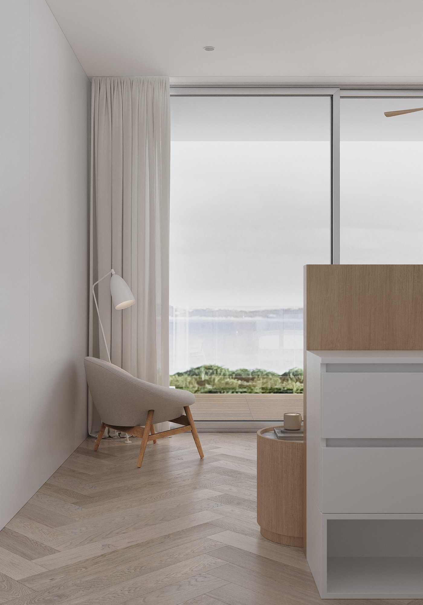 Minimalist room with a beige armchair and a white wall, bright windows showing greenery, and natural wooden furniture.