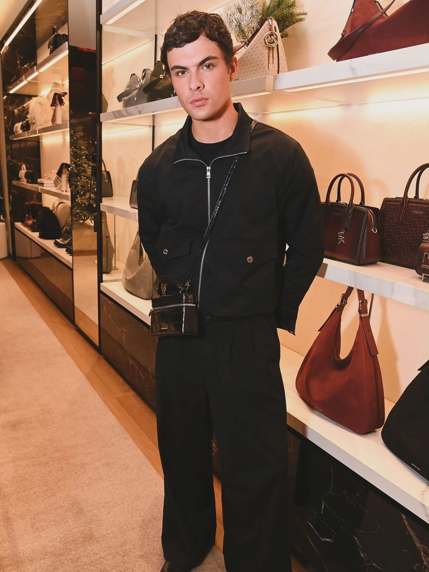 Will McCann attends the Michael Kors Holiday event hosted by Suki Waterhouse