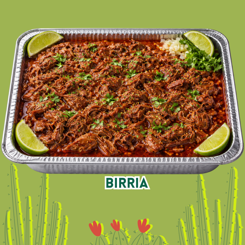 A tray of traditional Mexican birria, with shredded meat in a reddish sauce, garnished with cilantro and lime wedges, accompanied by chopped onions and cilantro.
