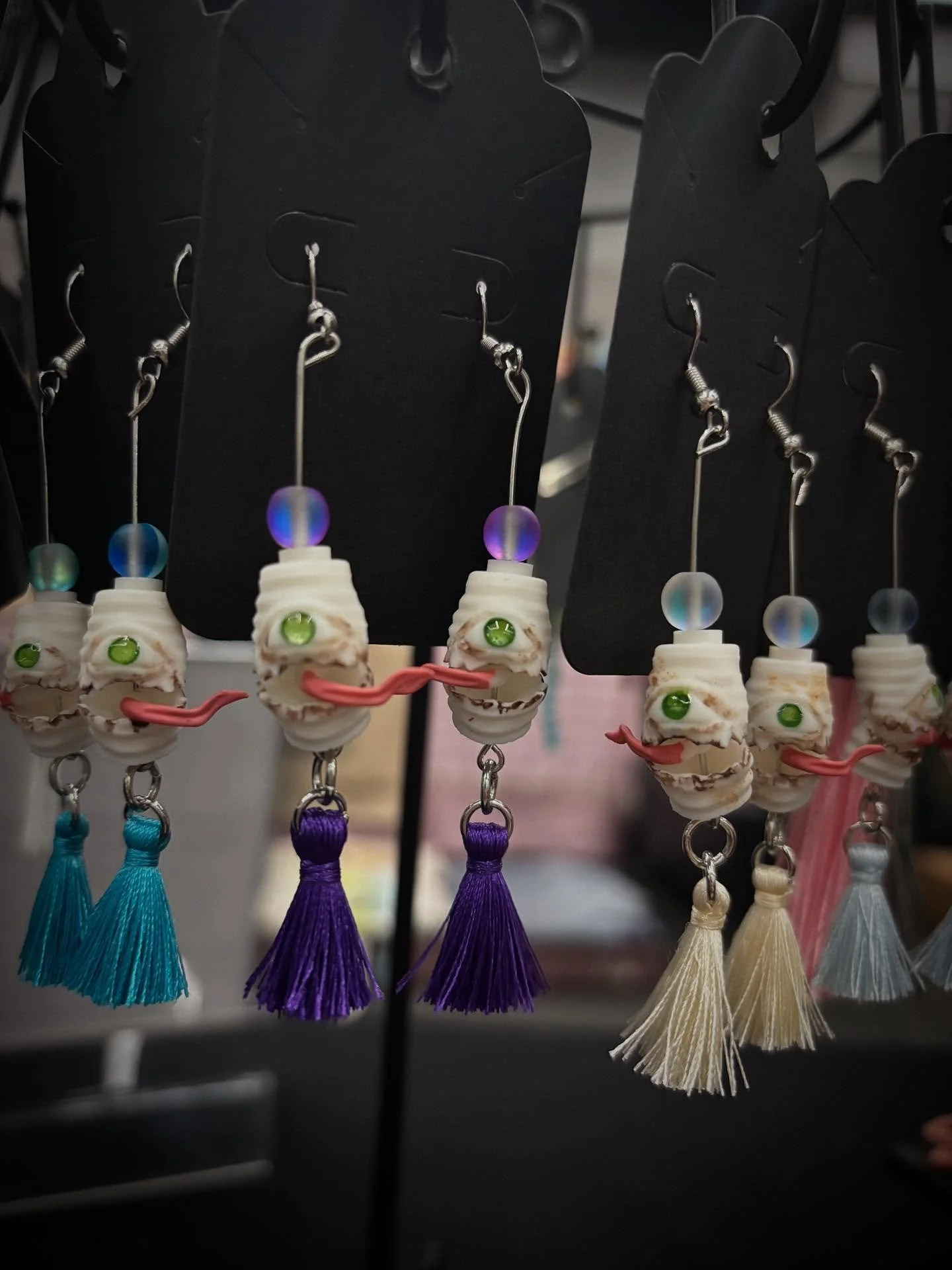 Set up at Rose City Comic Con and we&rsquo;re debuting some new lines of merch including some jewelry like these chouchin earrings and kitsune mask brooches. We&rsquo;ve also got tiny jointed art toys and keychains, along with some of our painted 1:1