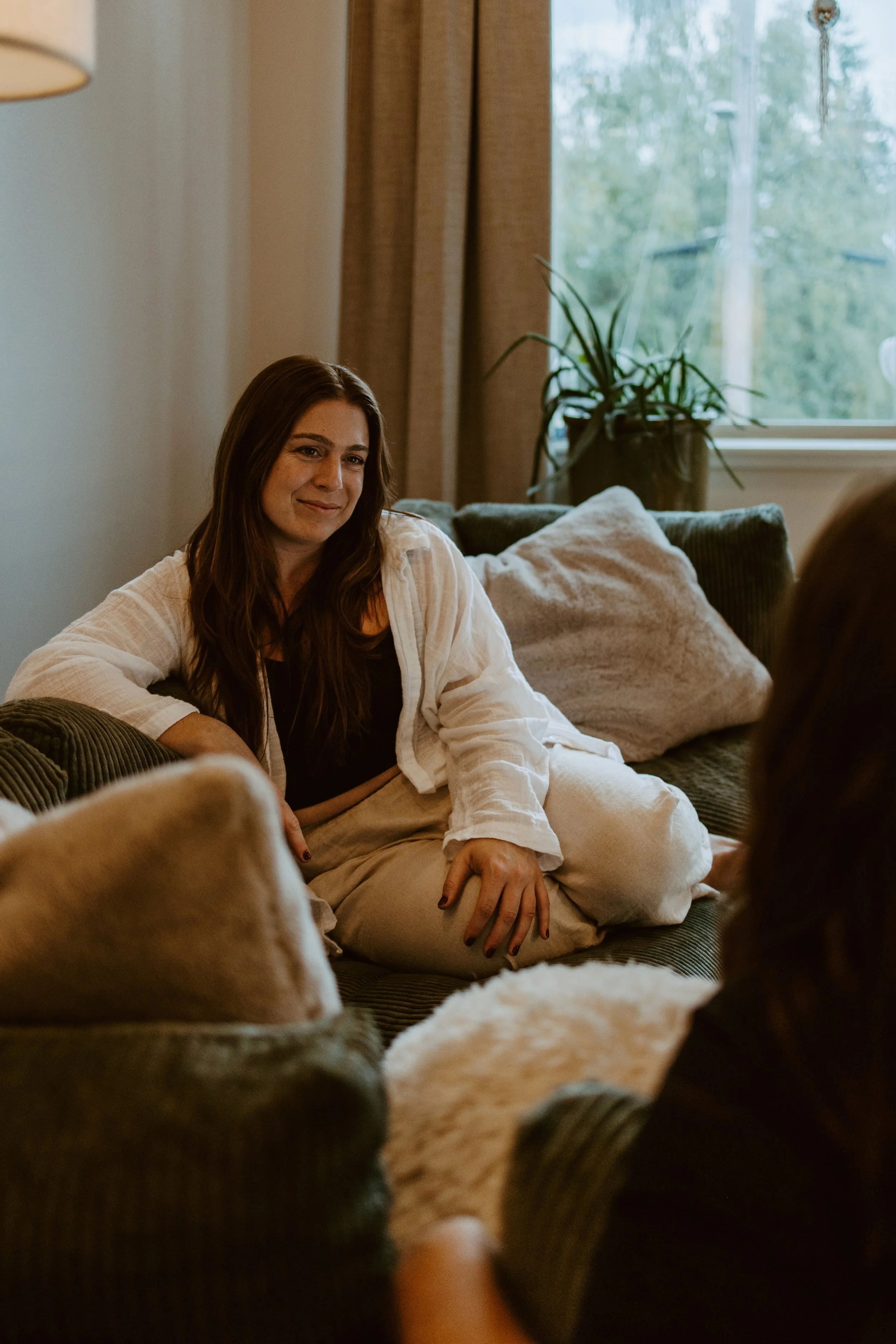 Melanie Rogers smiling and actively listening during a coaching shoot.