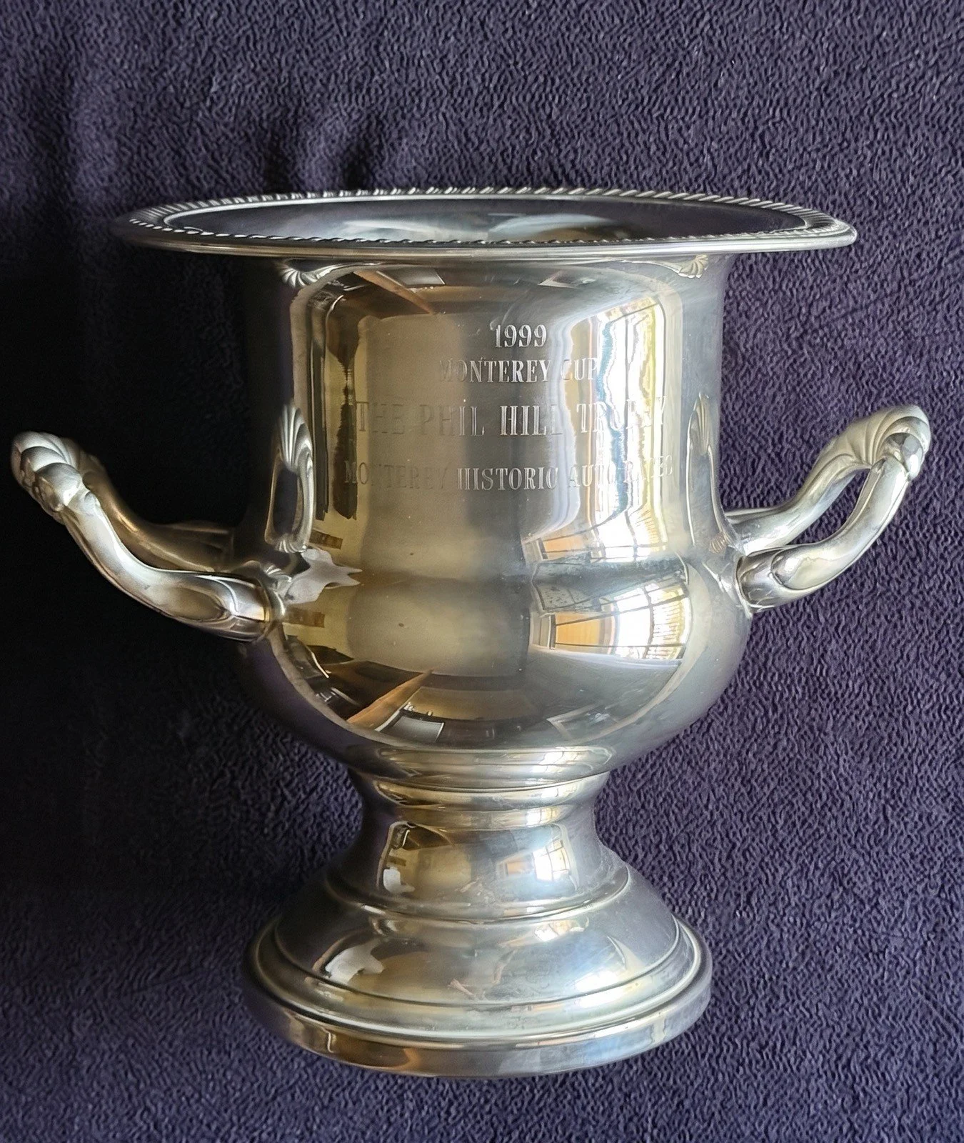 Silver cup-style trophy engraved: 1999 Monterey Cup • The Phil Hill Trophy • Monterey Historic Automobile Races. This trophy was awarded to David Love and his 1958 Ferrari 250 TR No. 0754. The Phil Hill Trophy is presented annually to the driver or e