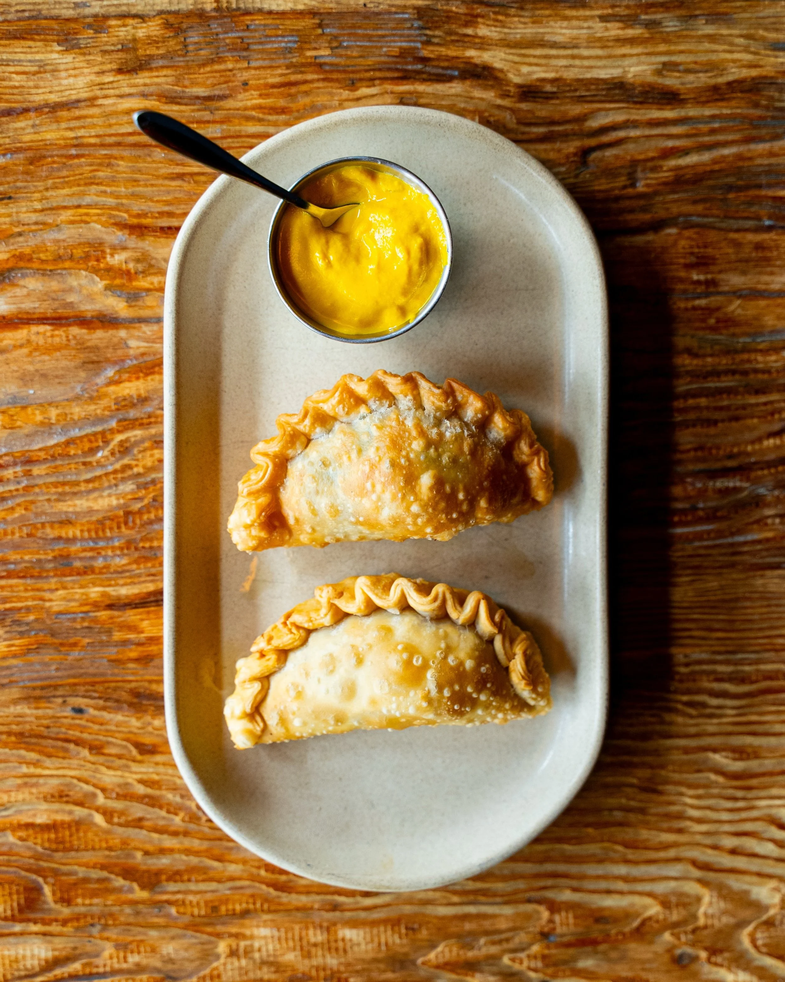 Empanadas de carne&mdash;wagyu ground beef, salsa criollo, golden and just the right kind of indulgent.

Only available at brunch on the weekends, or late night&hellip; and now Mondays during our Gran Fiesta (5-7pm)! So yes, you&rsquo;ll want to plan