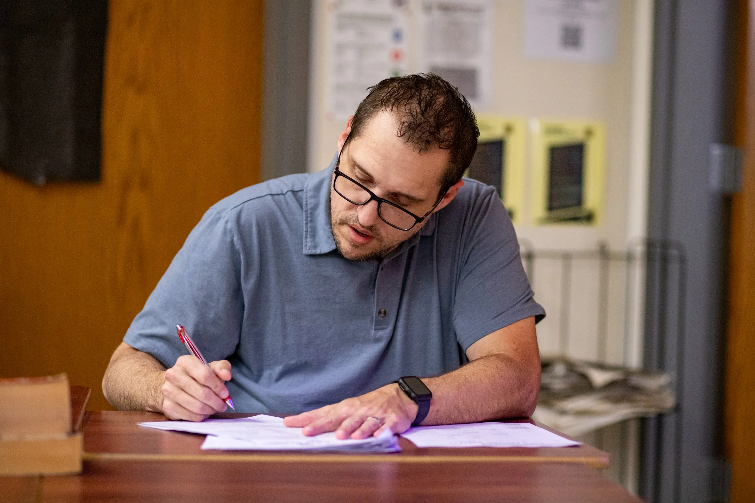 Hale carefully grades the practice UIL Copy Editing Contest his newspaper students took 20 minutes prior. The purpose of the practice tests is to see how the students would score if the contest were a real one and where improvements could be made. 