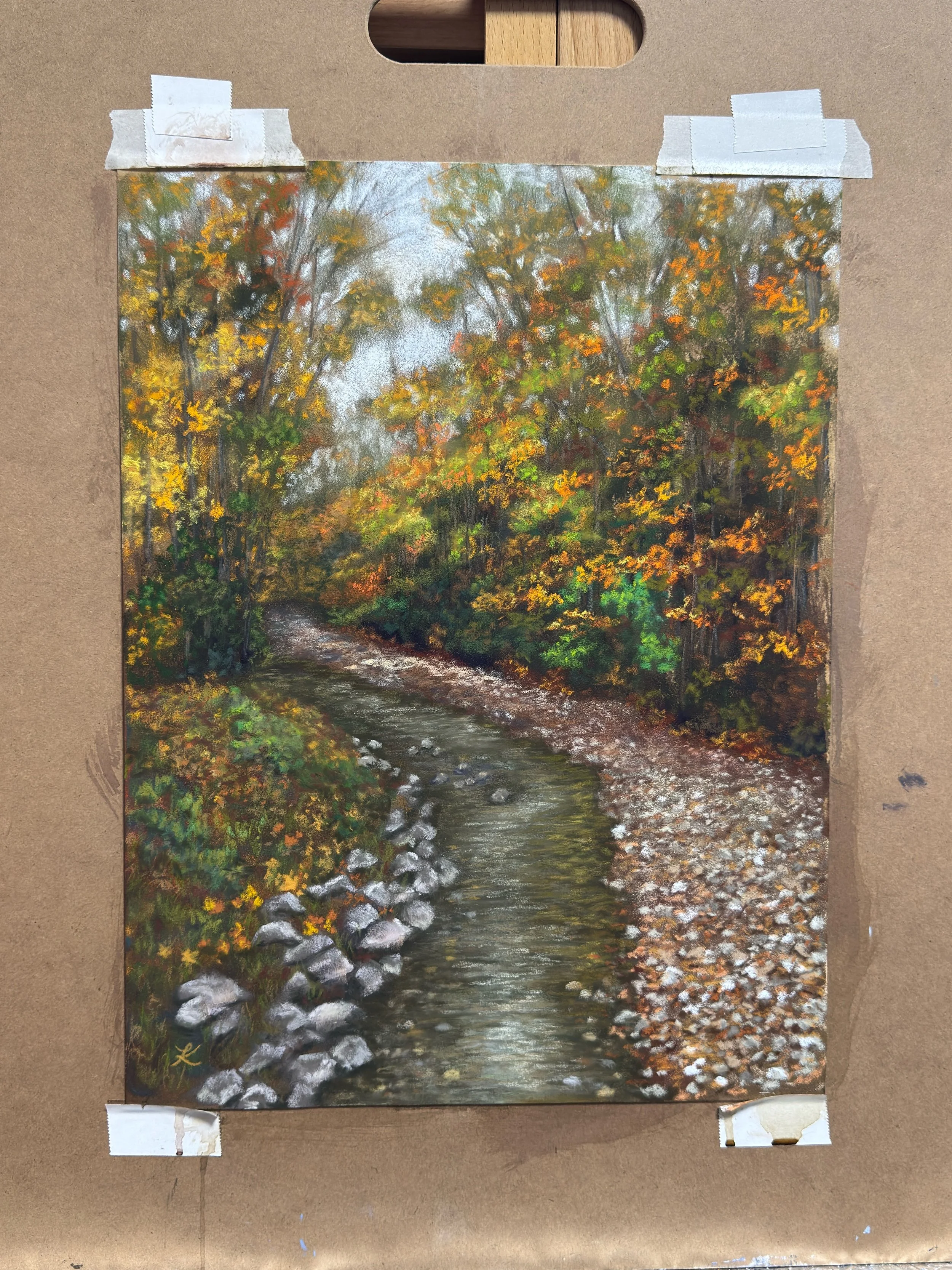 Painting of Vermont fall stream surrounded by trees filled with leaves of green, gold, and orange