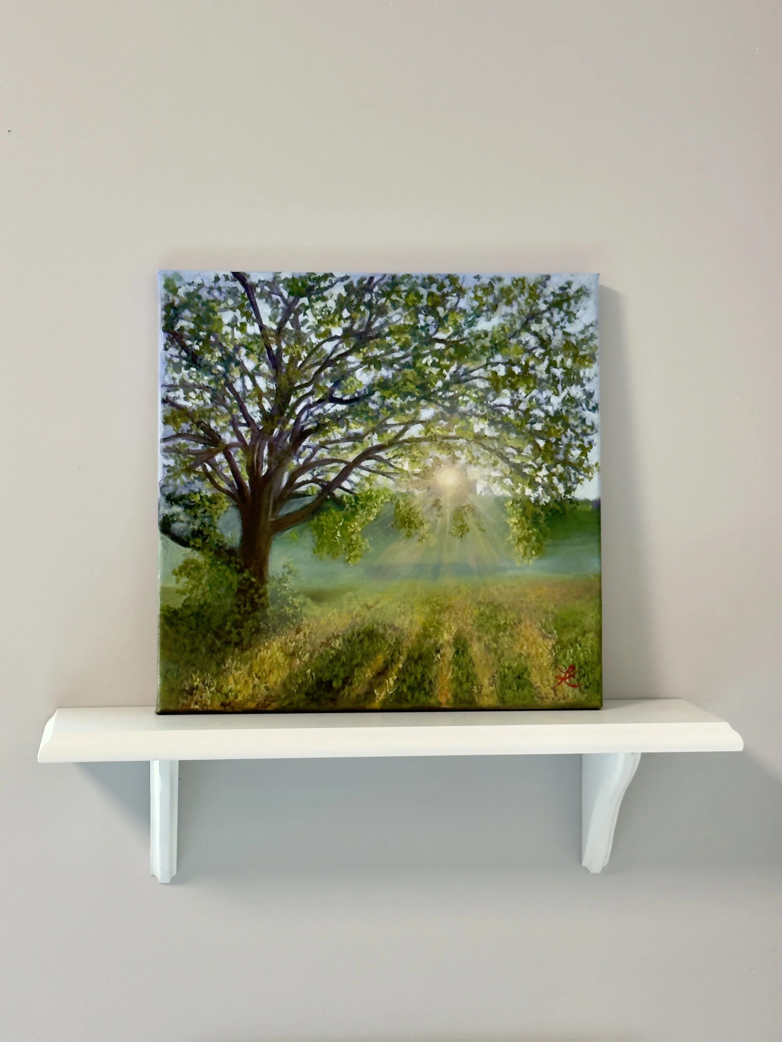 Oil painting of sunrise shining through the branches of an oak tree