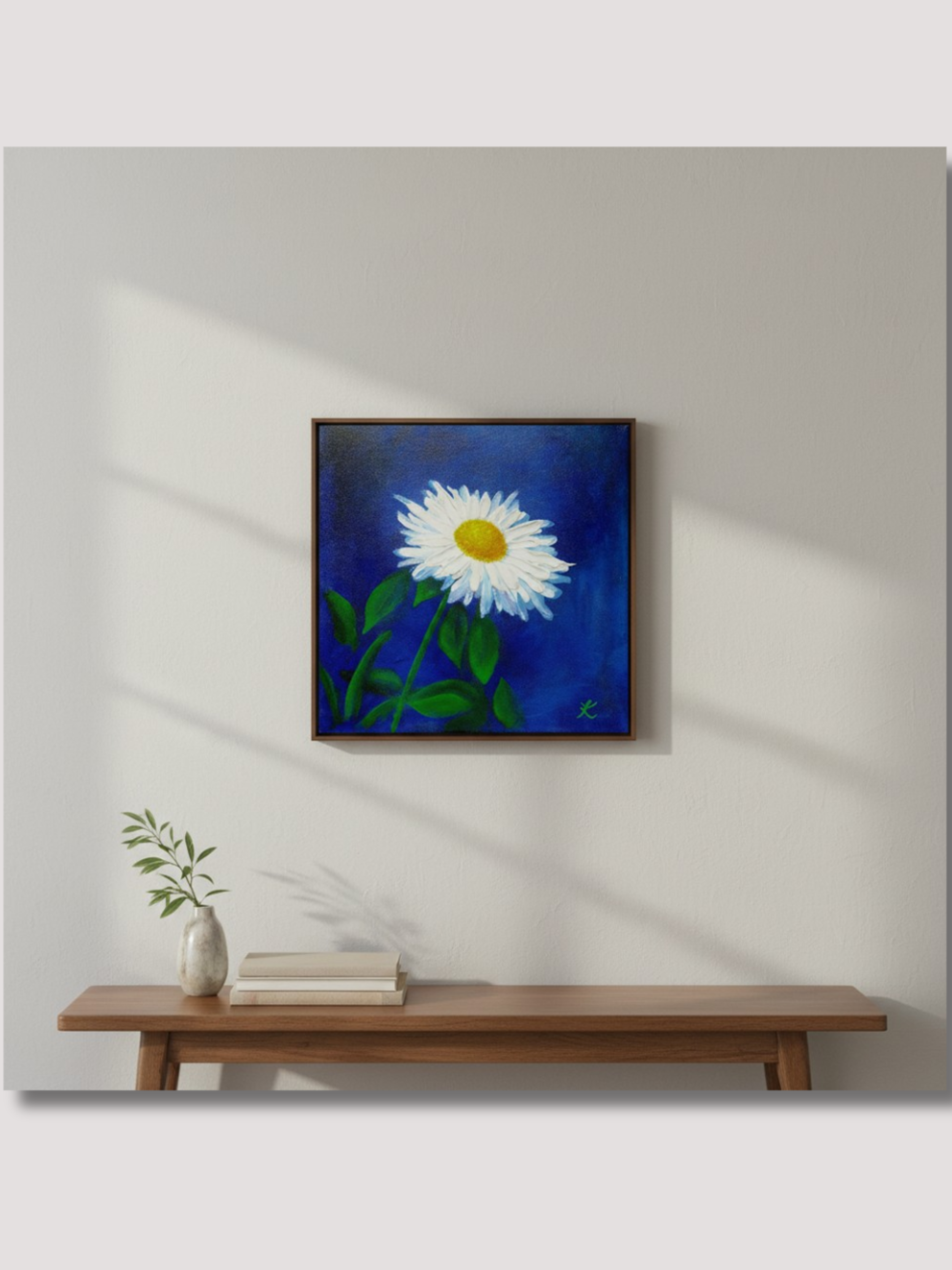Acrylic painting of single daisy on cobalt blue background, hanging on a wall