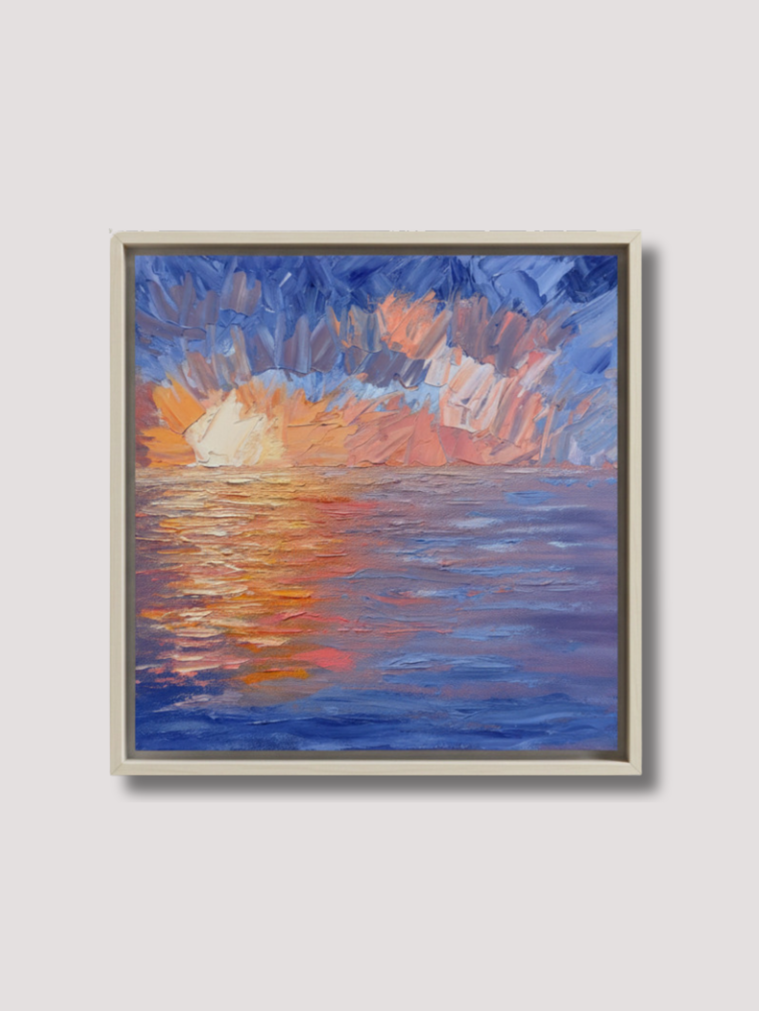 Framed impressionistic oil painting of a sunset over the ocean