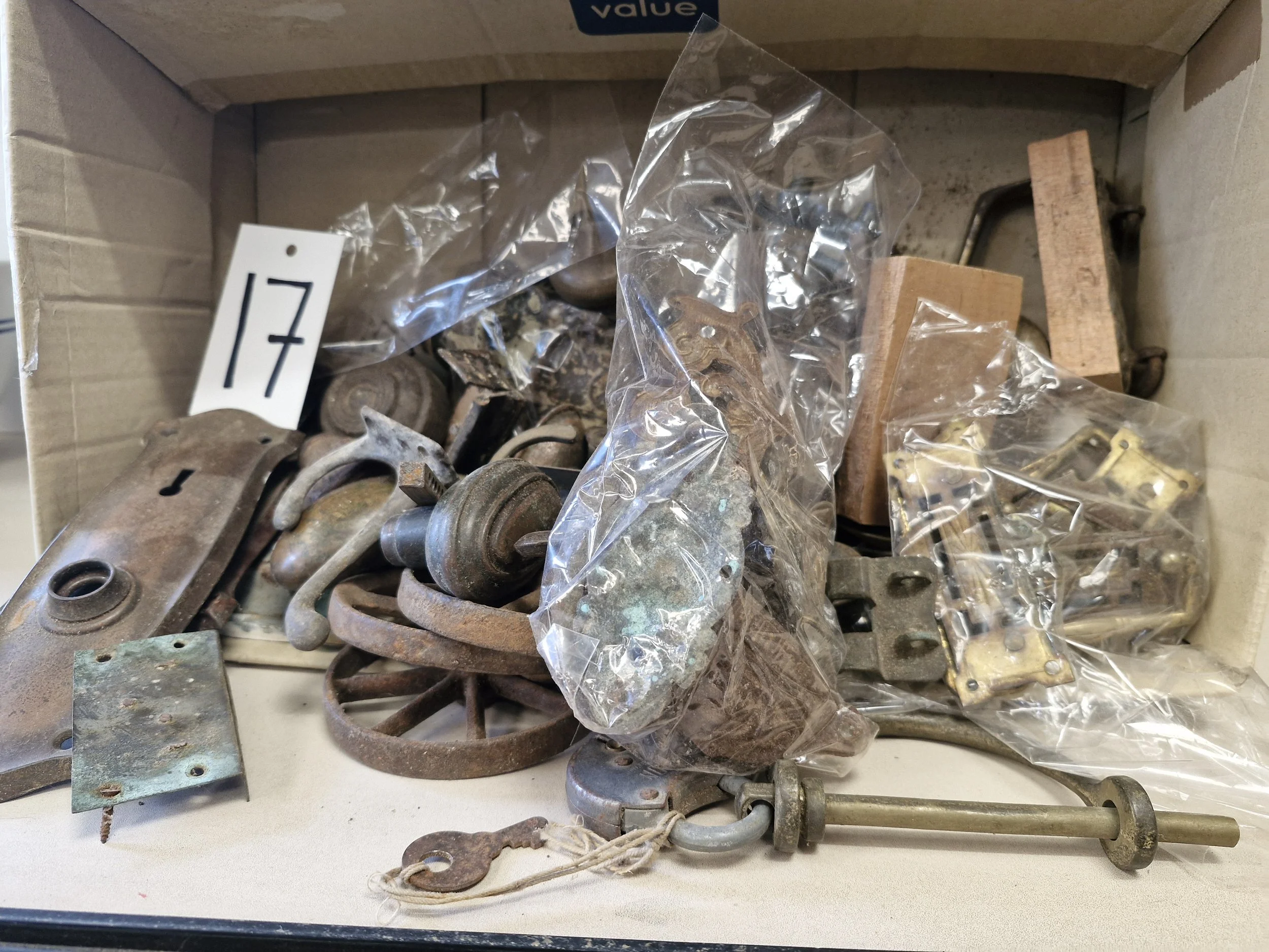 Box of assorted metal pieces