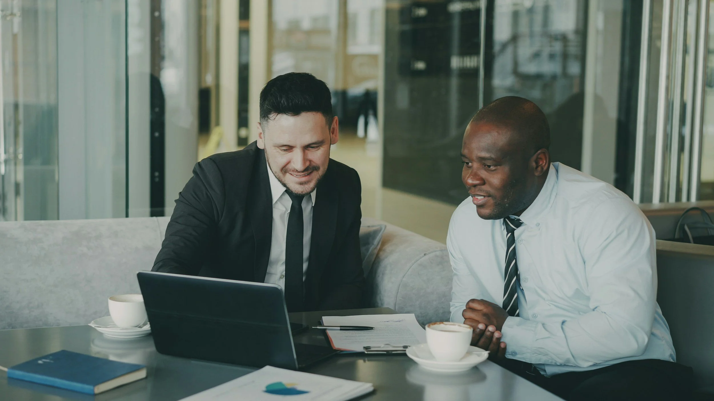 Financial professionals reviewing client plans during a collaborative meeting
