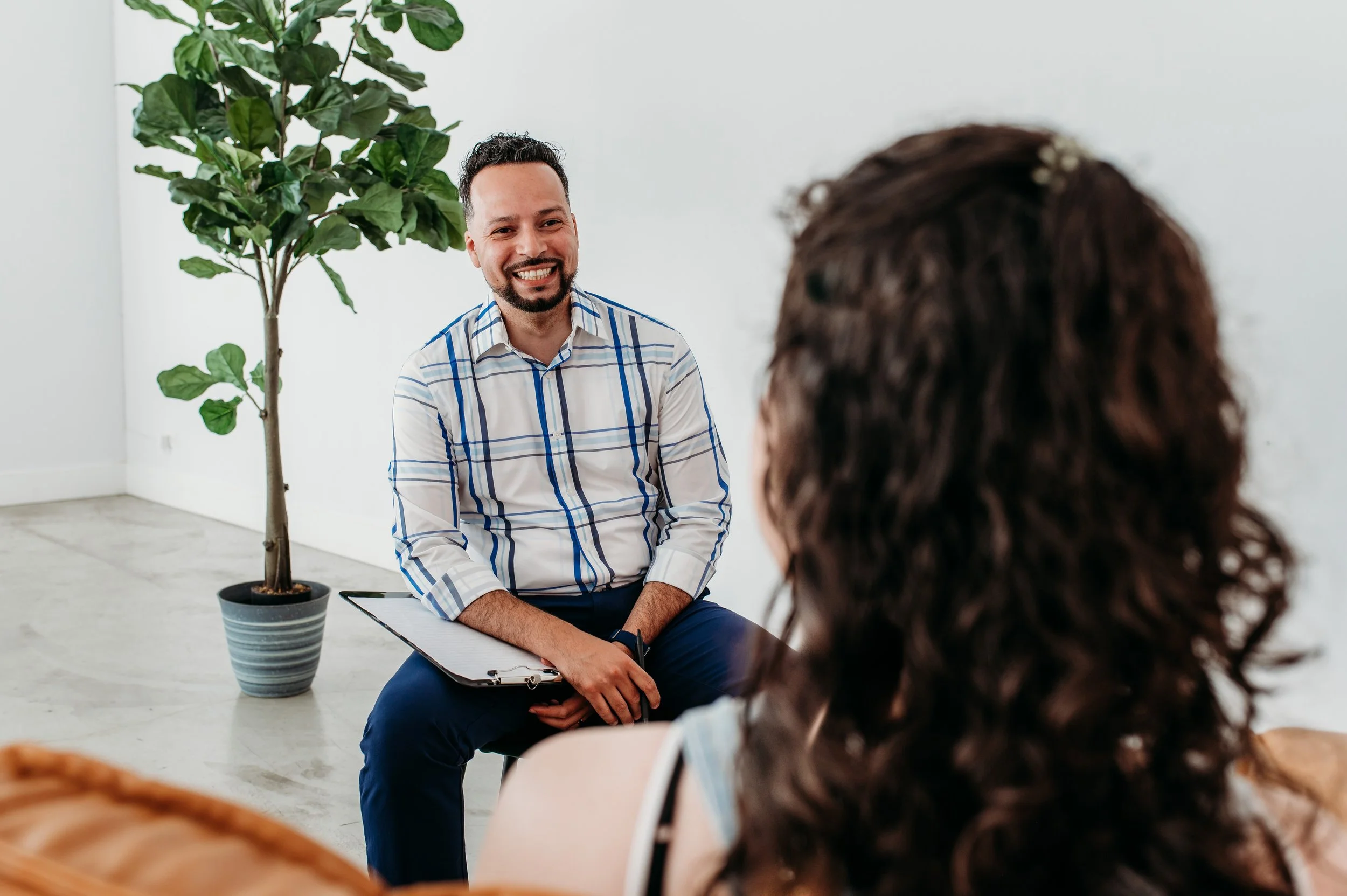 Financial therapist meeting with client to address money stress, emotions, and decision-making