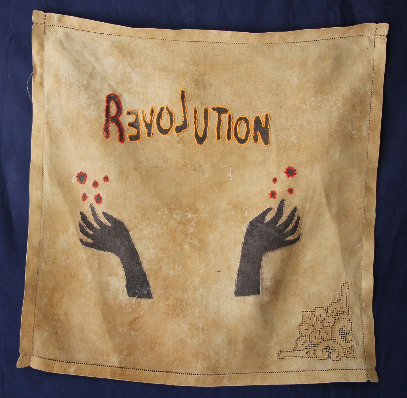 We need a Revolution (2024)—Vintage Linen Napkin, dyed with oak gall tannin, iron mordant print, and silk embroidery