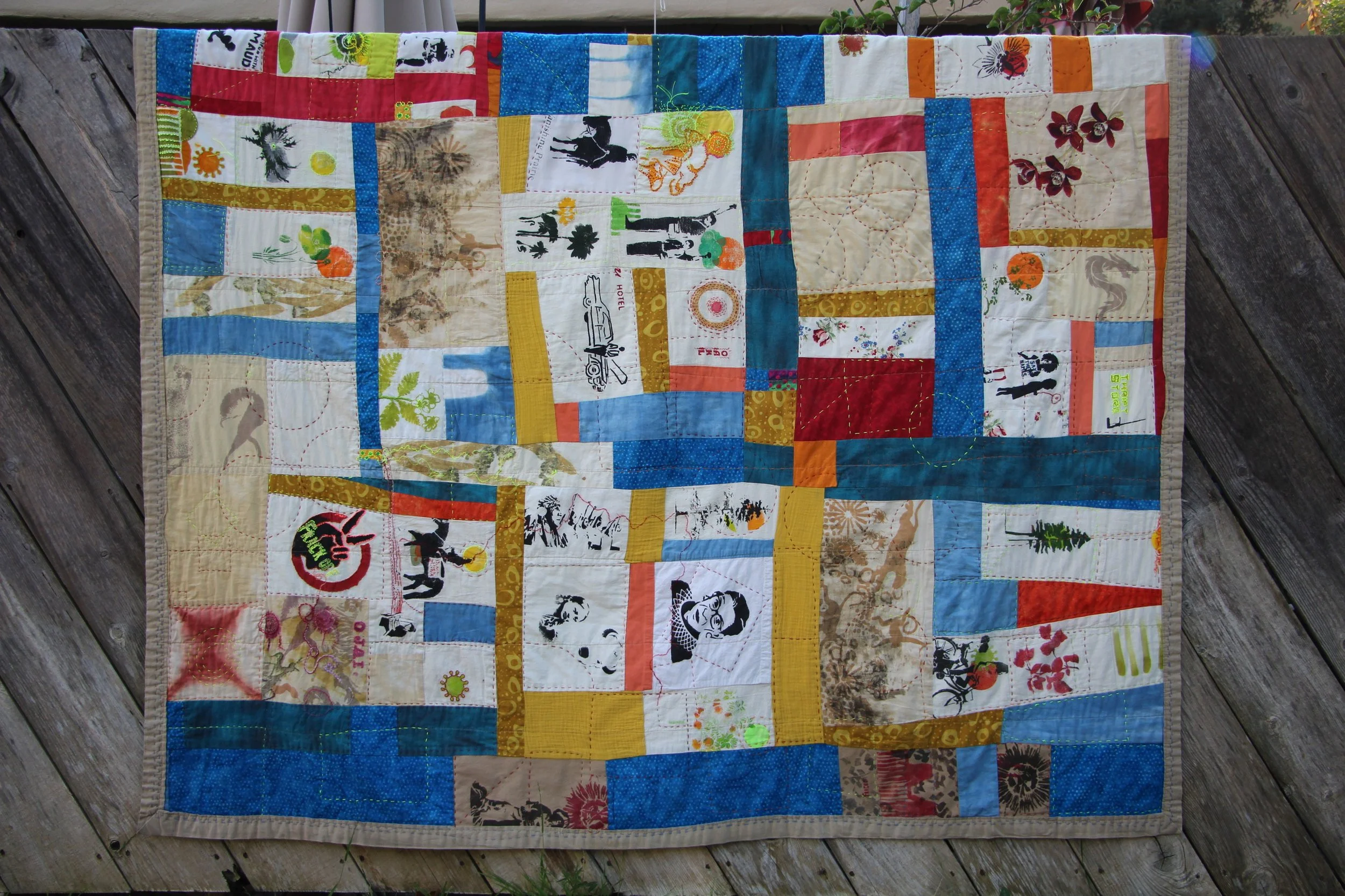 Memorial quilt composed of hand-printed swatches sewn together to honor the Black Lives Matter movement and victims of racial violence (2021) 