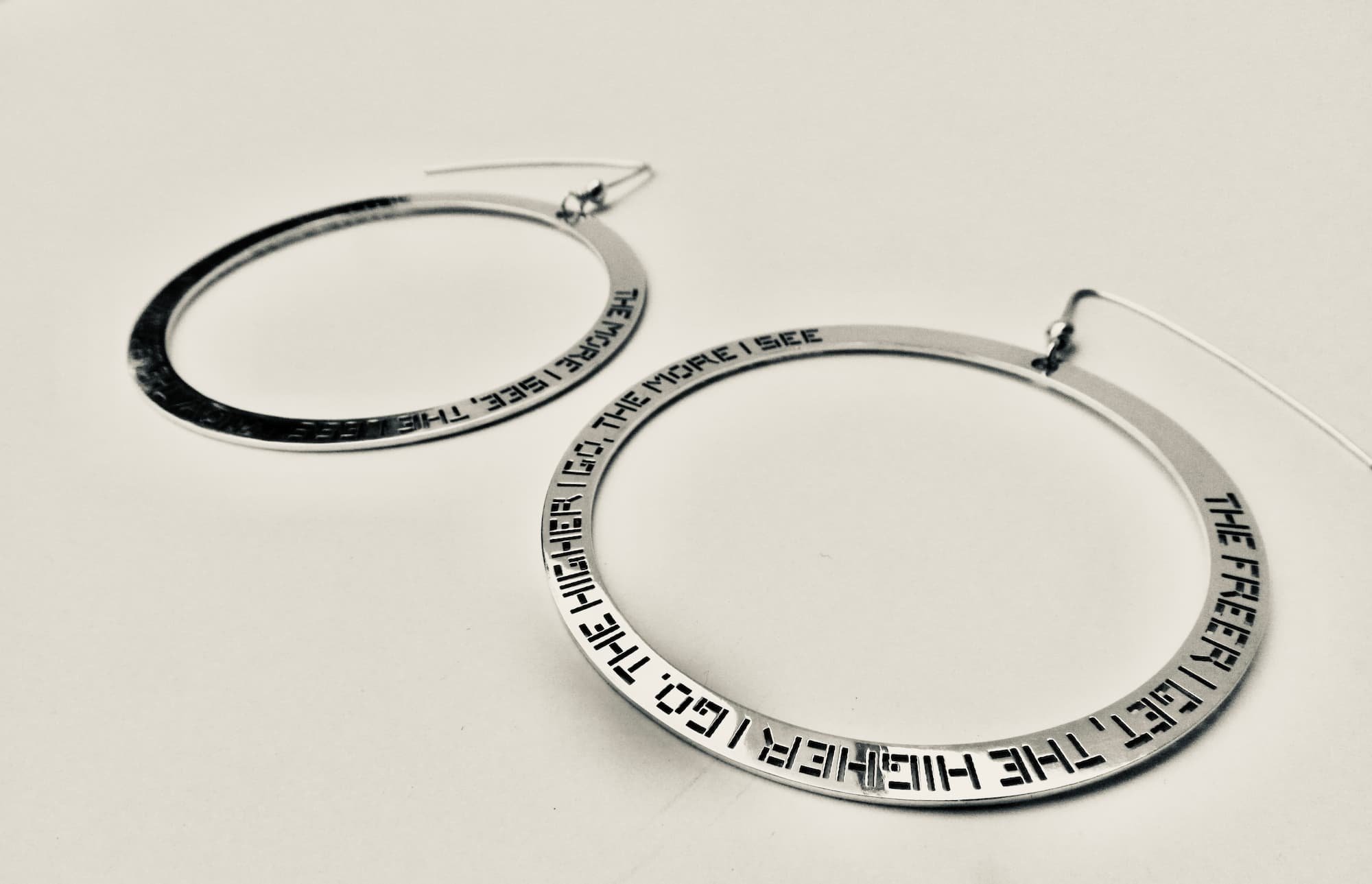 'The freer I get, the higher I go. The higher I go, the more I see. The more I see, the less I know. The less I know, the more I'm me.' Earrings - Sterling Silver