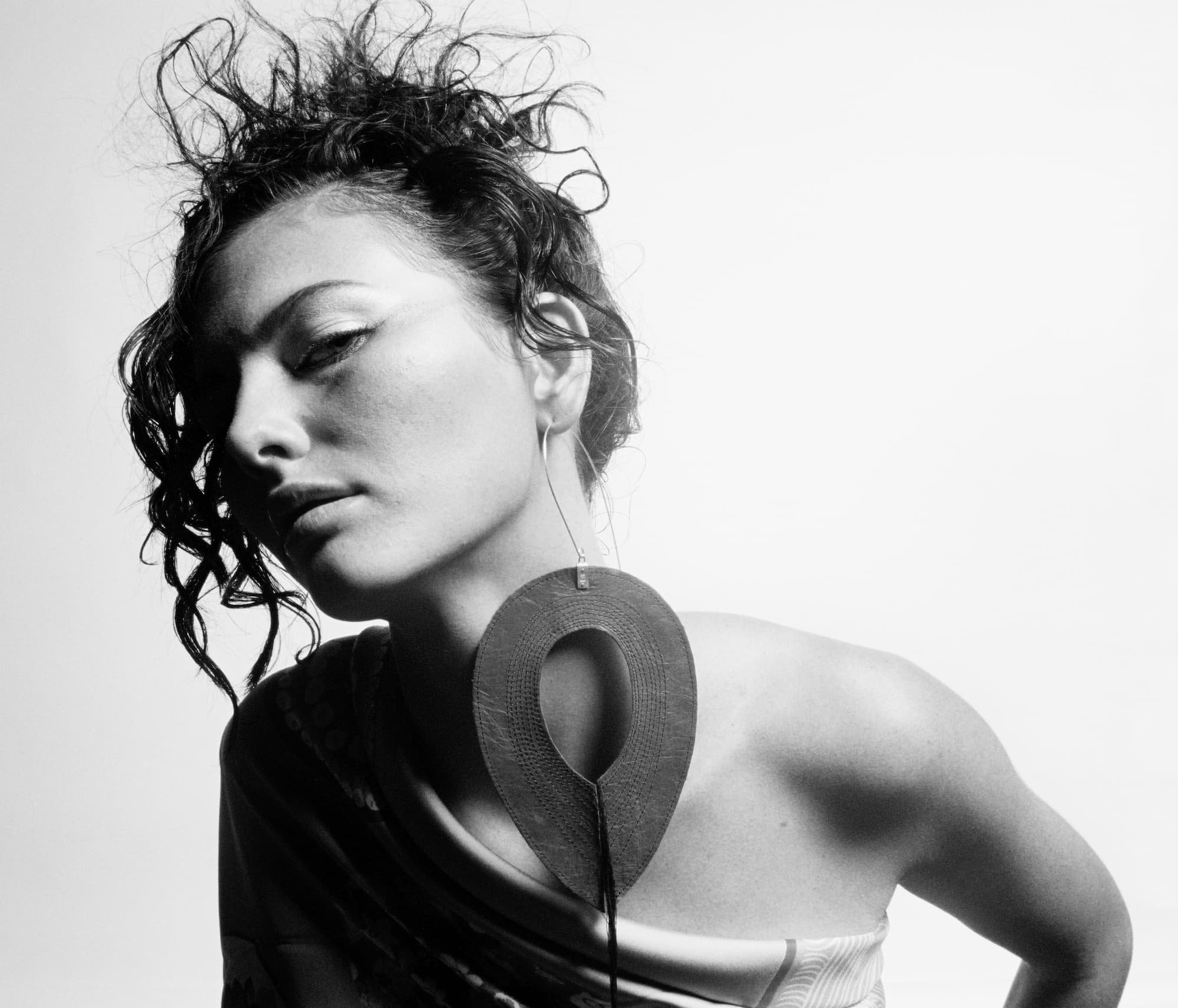 Oversized earring from 2003. Leather and silver. Photo by Susan Grdunac.