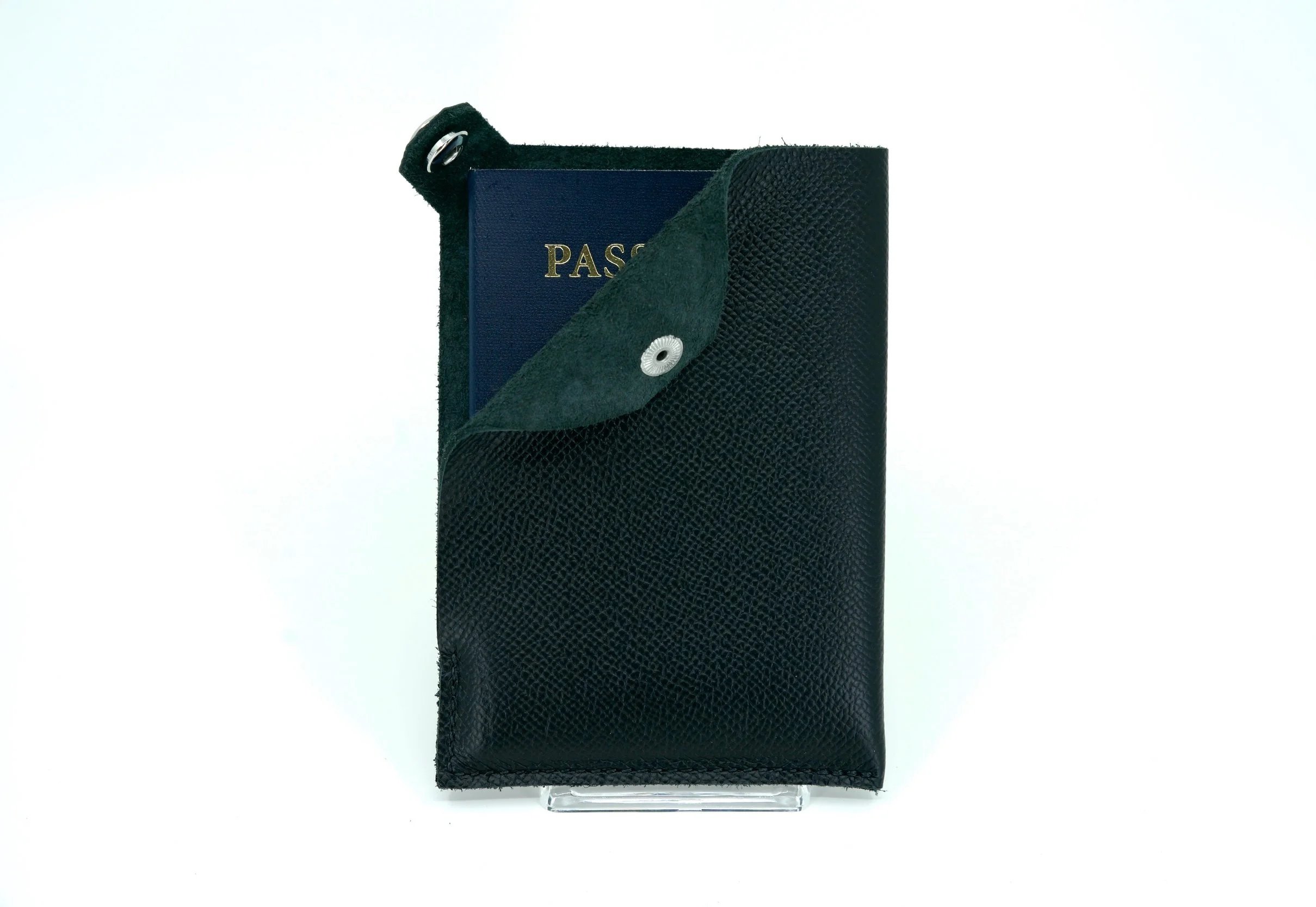 Saddle-stitched leather passport holder for Cuirated referral program