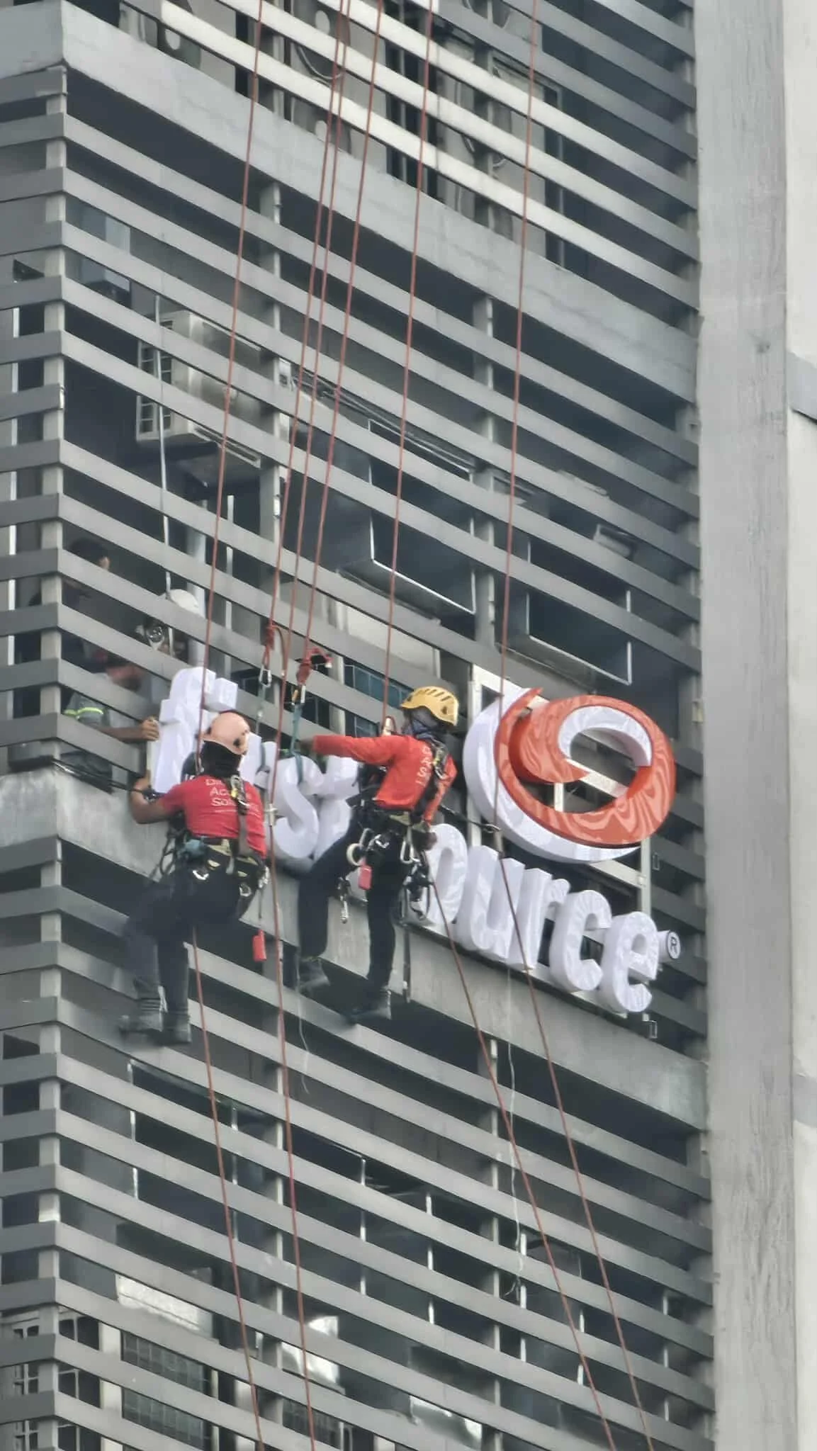 High rise building installation of outdoor custom signage services