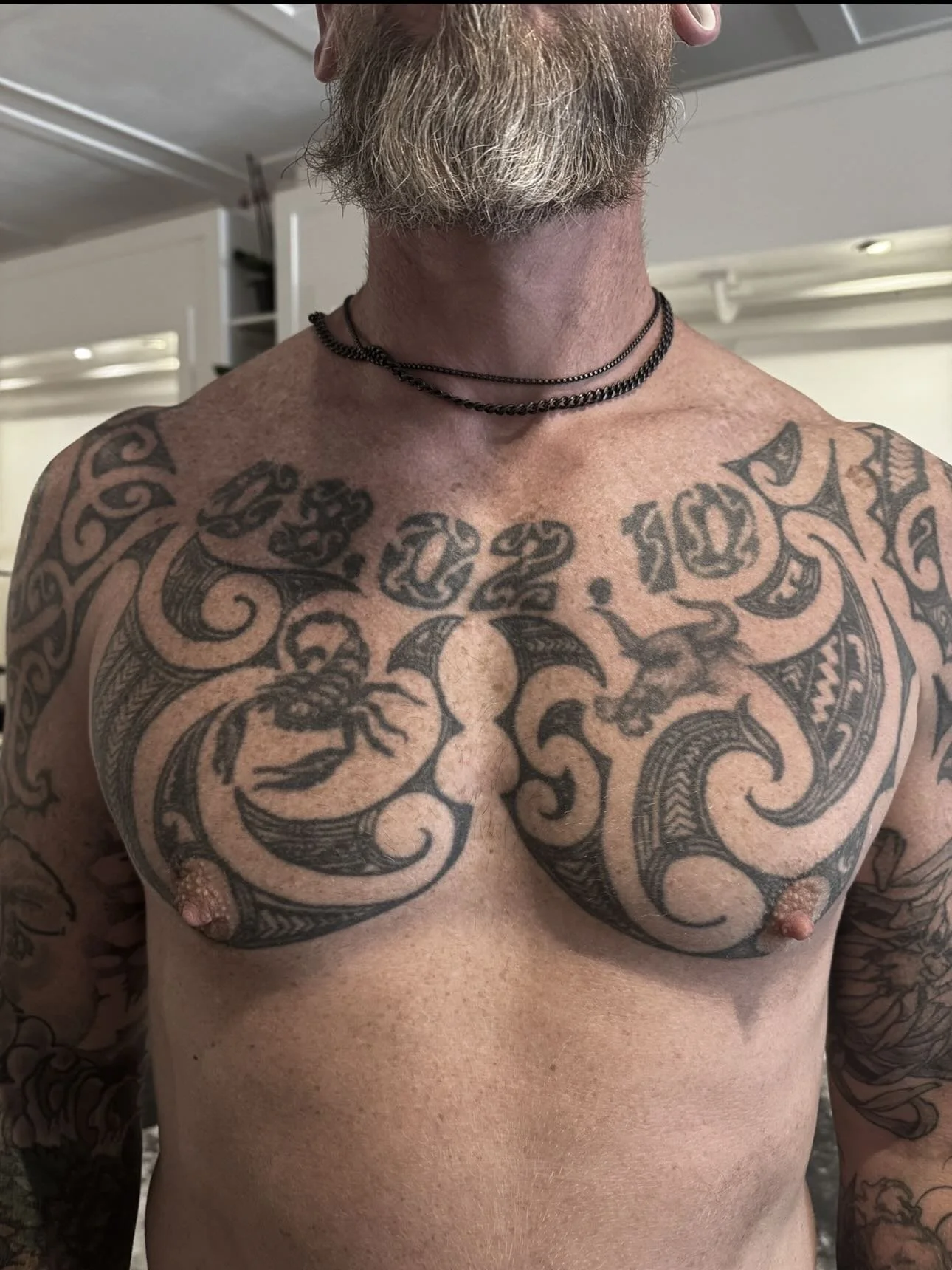 Quite the challenge! Swipe to see the result. Robert asked me if we could get rid of the GIANT date on is chest with an owl design without covering his other chest pieces. So I went for texture to break the old tattoo and alot of black and shading. I