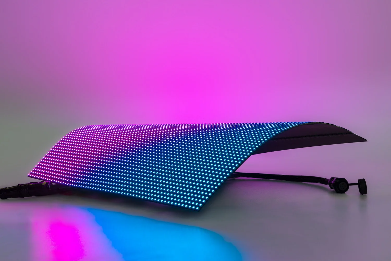 Ultra-light flexible LEDtecFlex™ LED wall foil glowing in pink and blue
