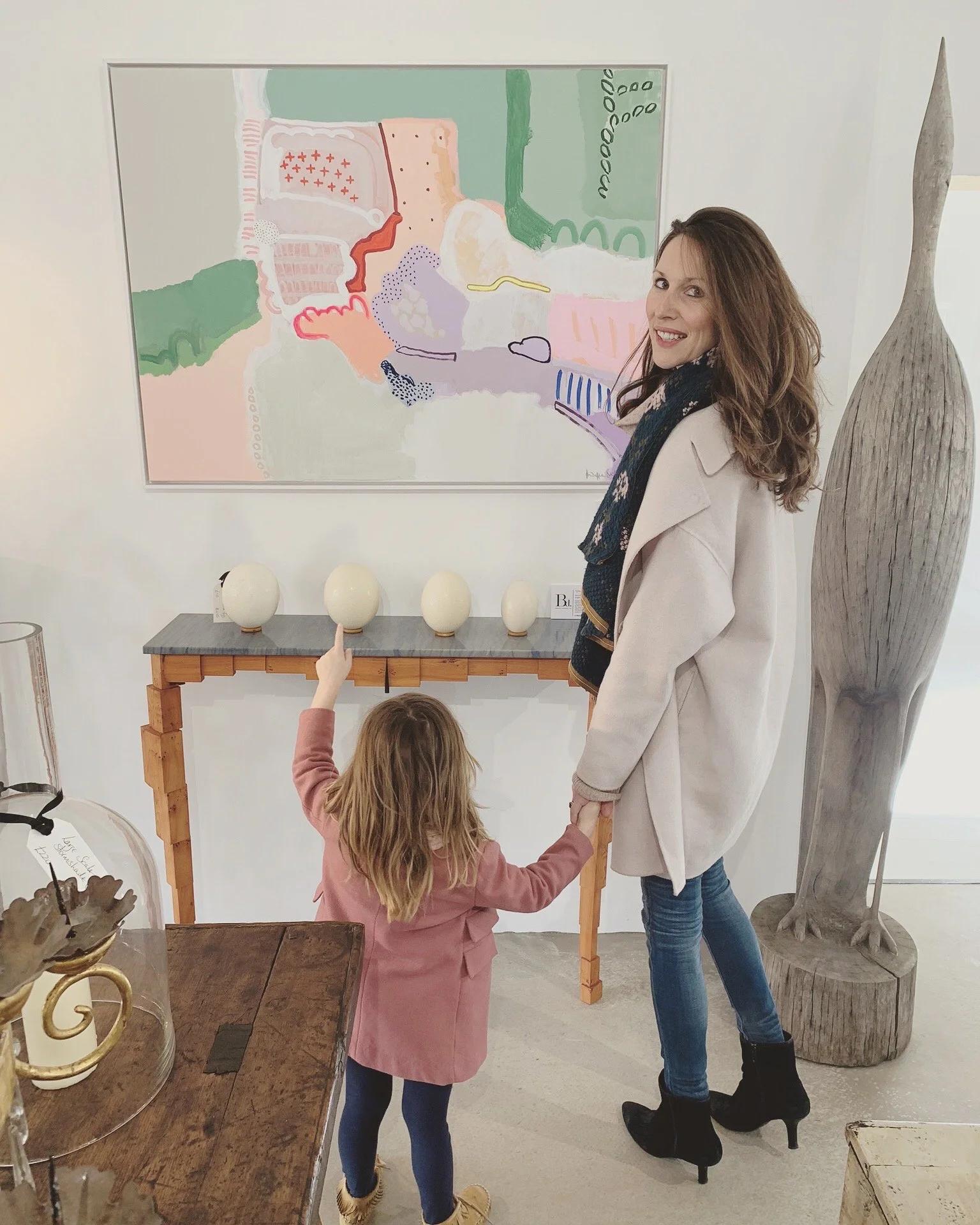 Artist Philippa Jeffrey with an original painting