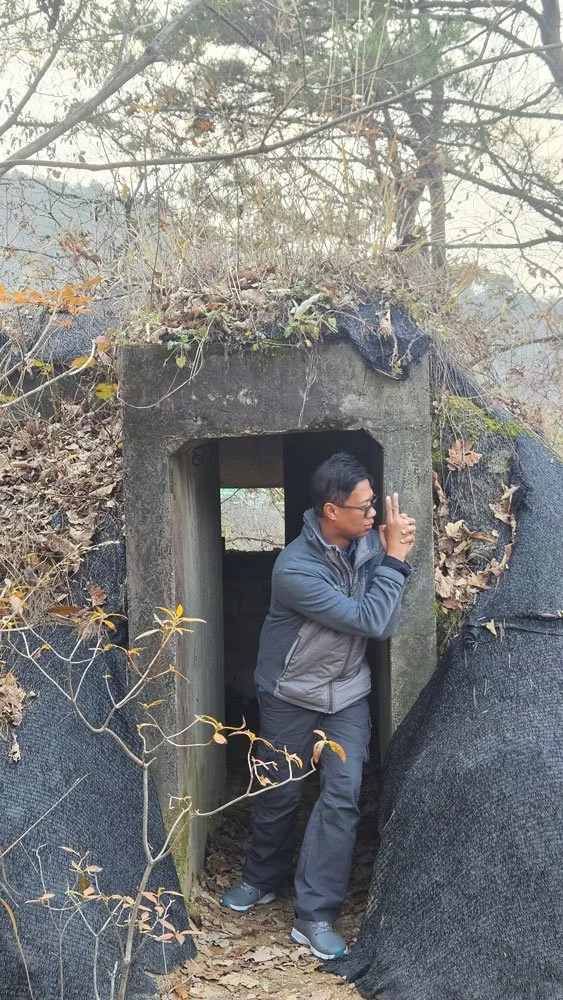 Madagascar tourists enjoying Gamaksan suspension bridge, autumn colors, clear blue sky, high-resolution travel image