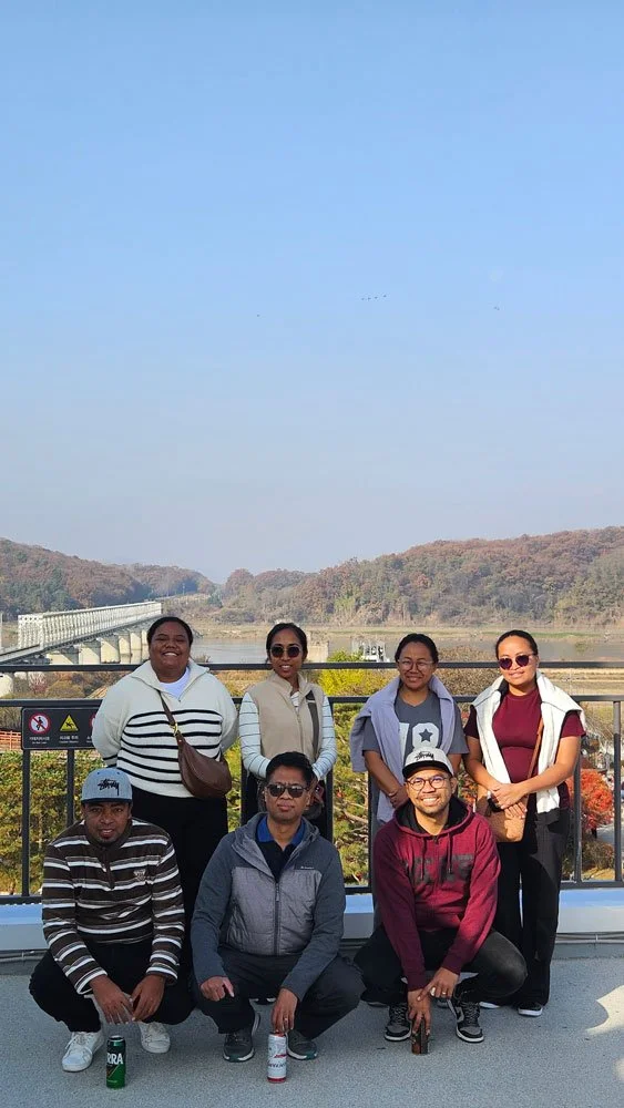 Private tour for Madagascar visitors at Imjingak, iconic Freedom Bridge, peaceful surroundings, mountains in the background, realistic and detailed travel image