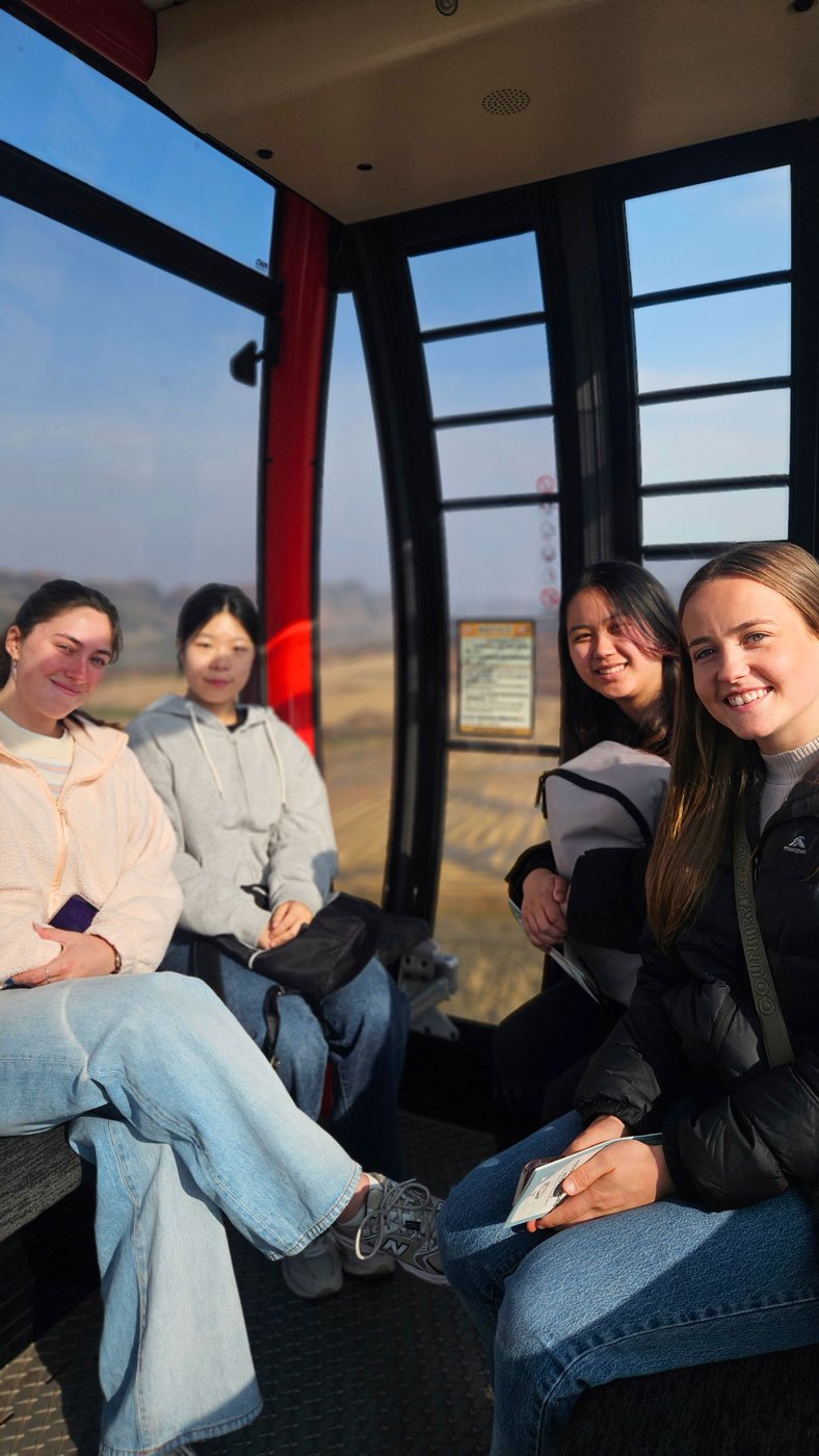Australian travelers on a private tour exploring the DMZ in Korea, overlooking the historic border between North and South Korea.