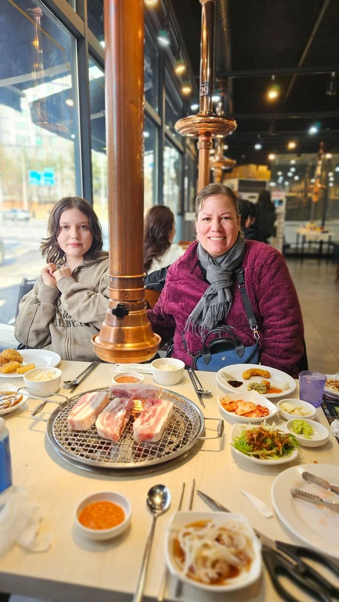 Mexico family enjoying a traditional Korean BBQ dinner in Seoul.