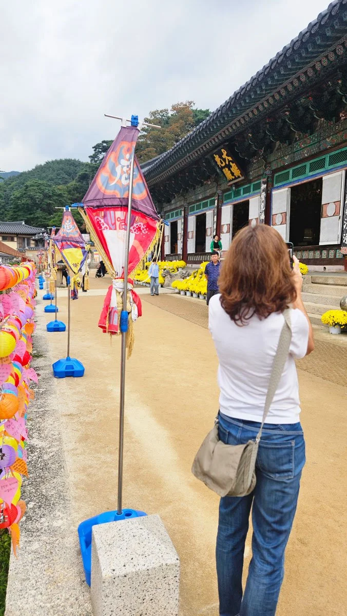 Spanish tourists experiencing a custom-made Korea tour visiting the Tripitaka Koreana at Haeinsa, learning about Korea’s historical wooden printing heritage.