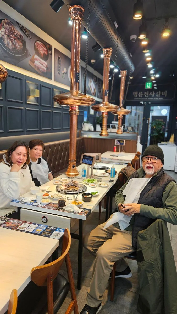 Filipino travelers enjoying Korean BBQ dining experience in Seoul