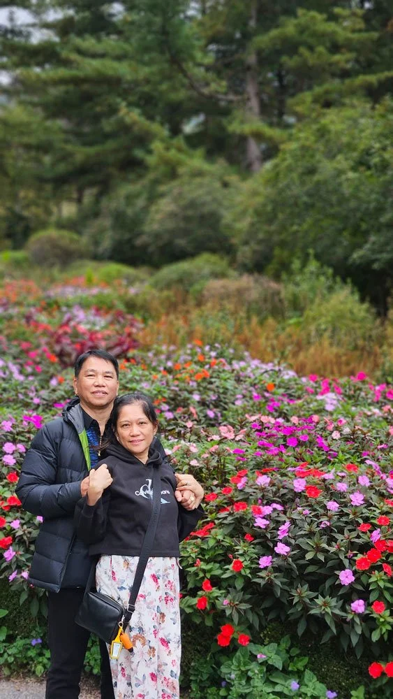 Filipino travelers enjoying the serene walking trails surrounded by nature at The Garden of Morning Calm.