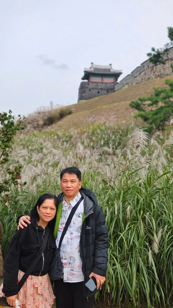 Filipino travelers on a private tour exploring the historic Suwon Hwaseong Fortress UNESCO World Heritage site.