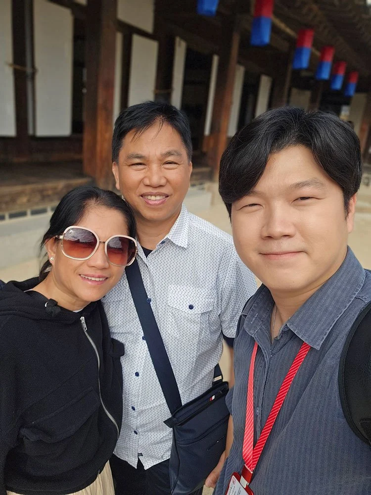 Filipino tourists exploring traditional houses at Namsangol Hanok Village during a private cultural tour.
