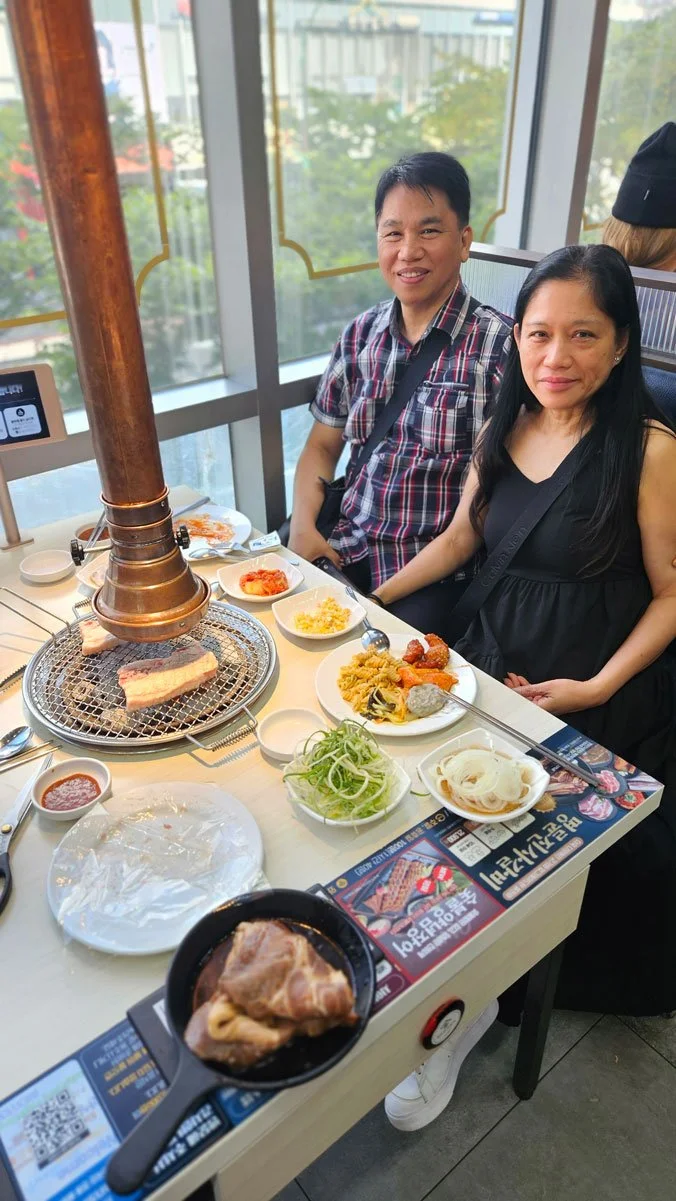 Filipino tourists enjoying authentic Korean BBQ during a private dining experience in Incheon.