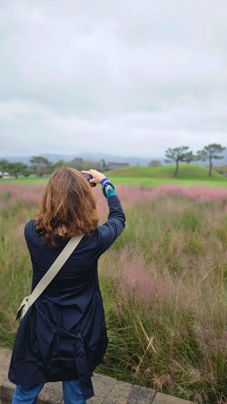 Spanish visitors on a premium Korea private tour exploring the peaceful burial mounds of Daereungwon, part of a fully customized travel itinerary.