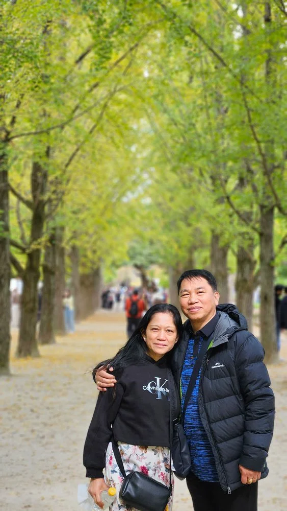 Filipino tourists exploring cultural art installations and sculptures on Nami Island.