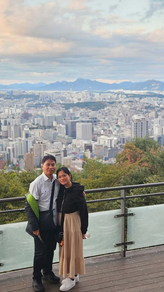 Filipino visitors capturing night views of Seoul during a private trip to N Seoul Tower.