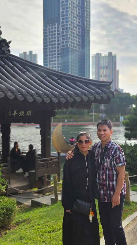 Filipino travelers enjoying a private tour at Songdo Central Park with modern waterfront views in Incheon.